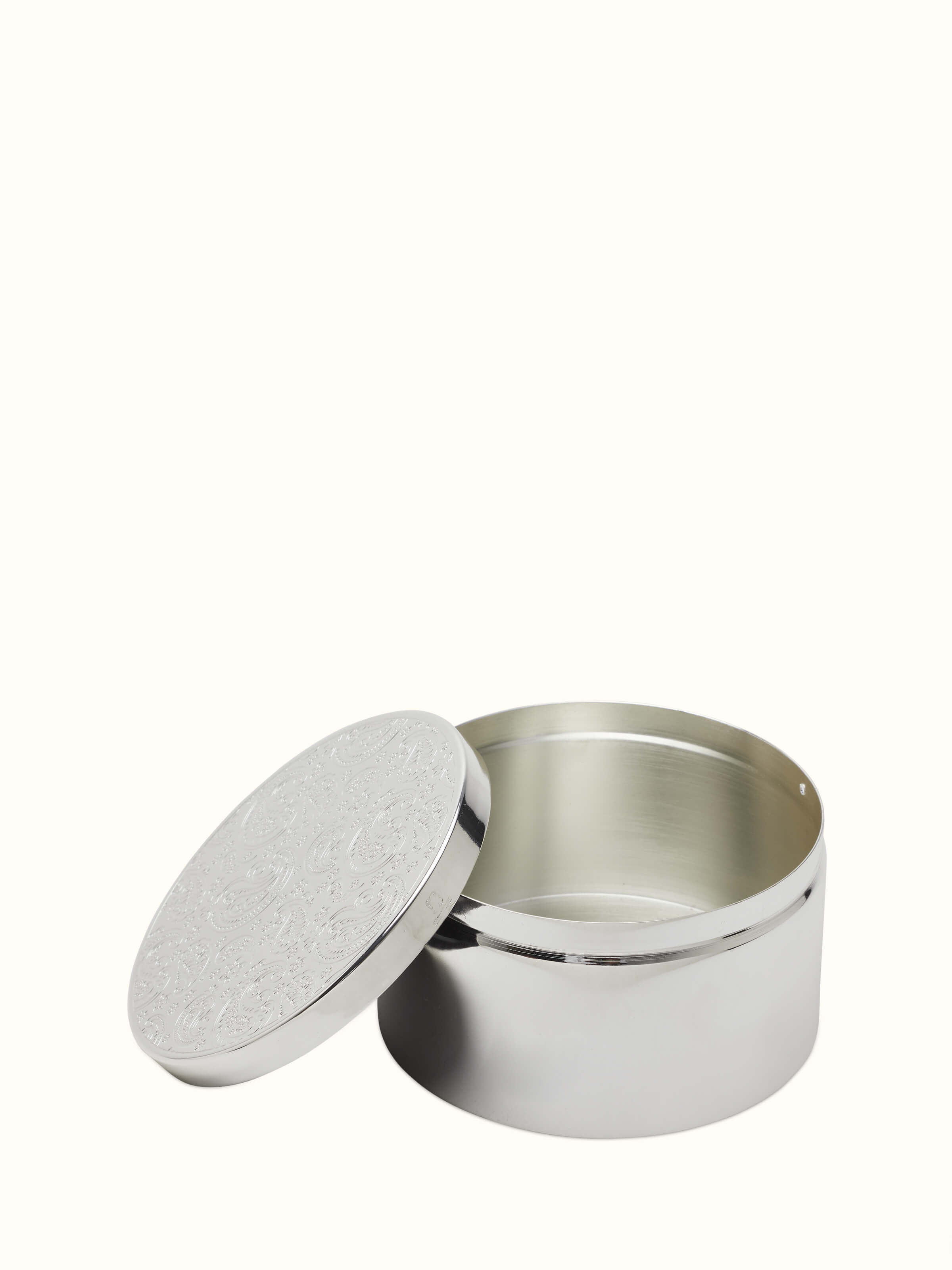 Detailed view of Silver-plated paisley round box, emphasizing the ornate paisley design.