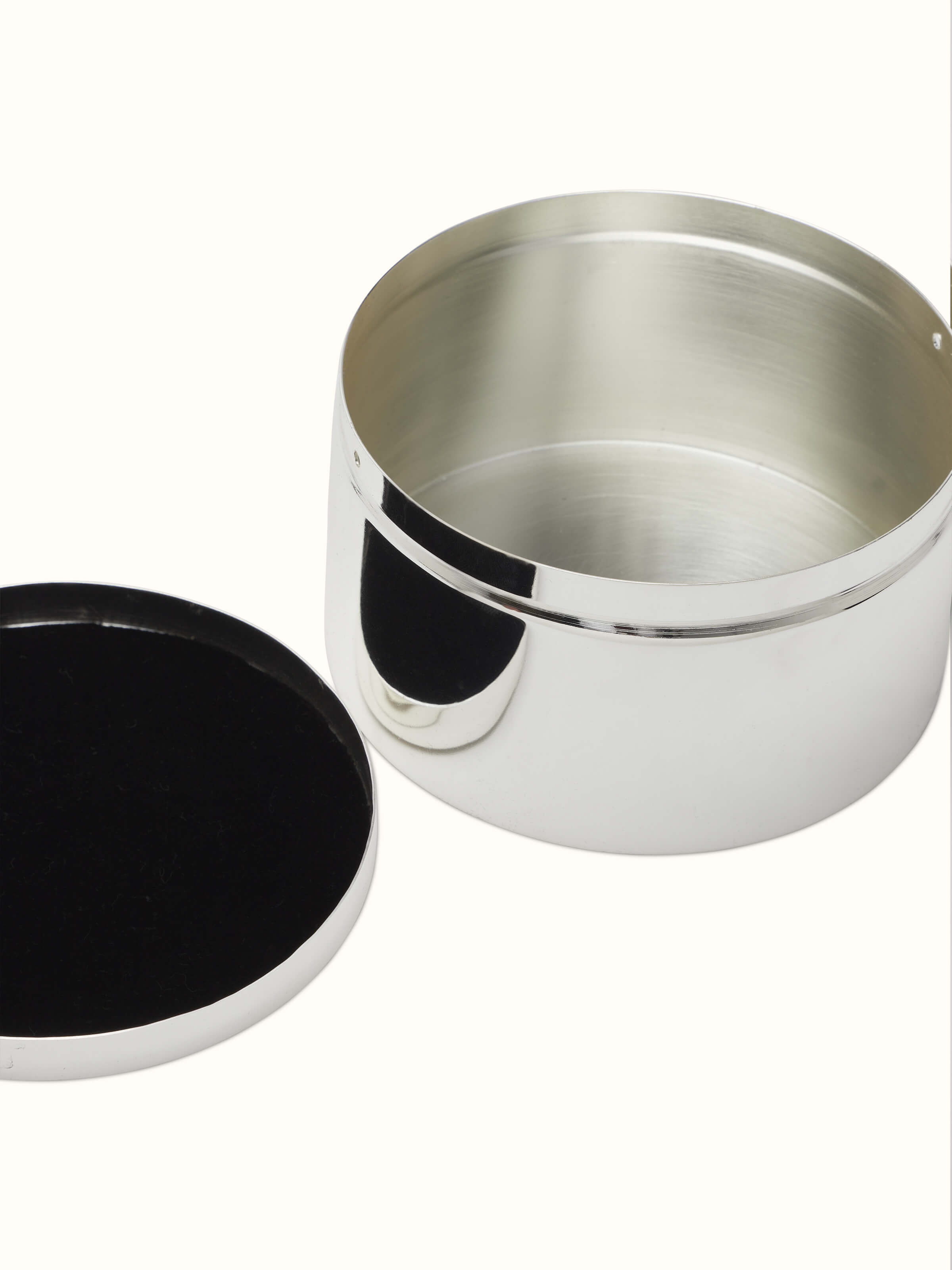 Artistic view of Silver-plated paisley round box, showcasing the elegant design and reflective finish.