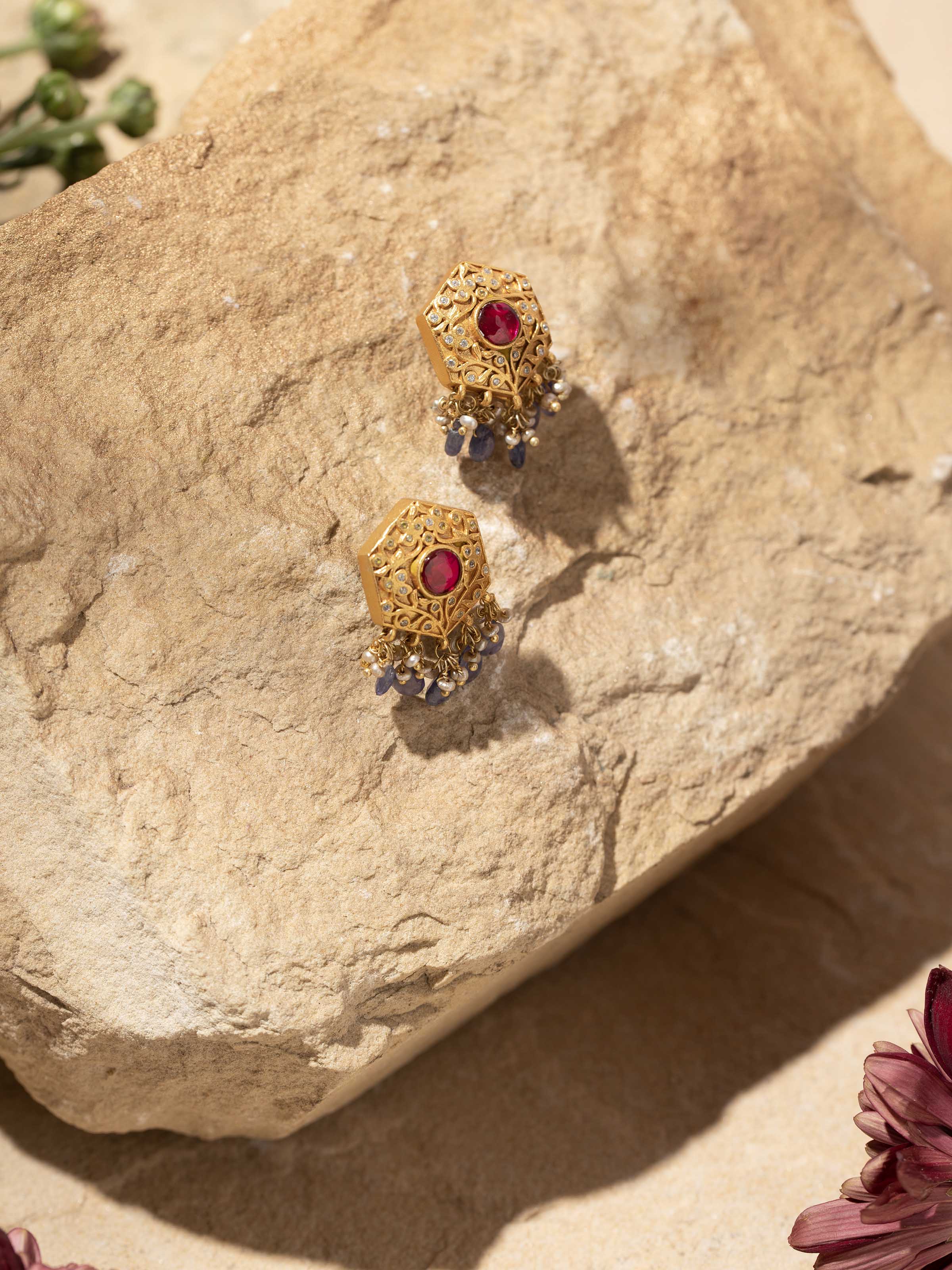 Side view of Silver Smithing Drop Earrings by Swadesh highlighting smooth drop design and elegant silver sheen