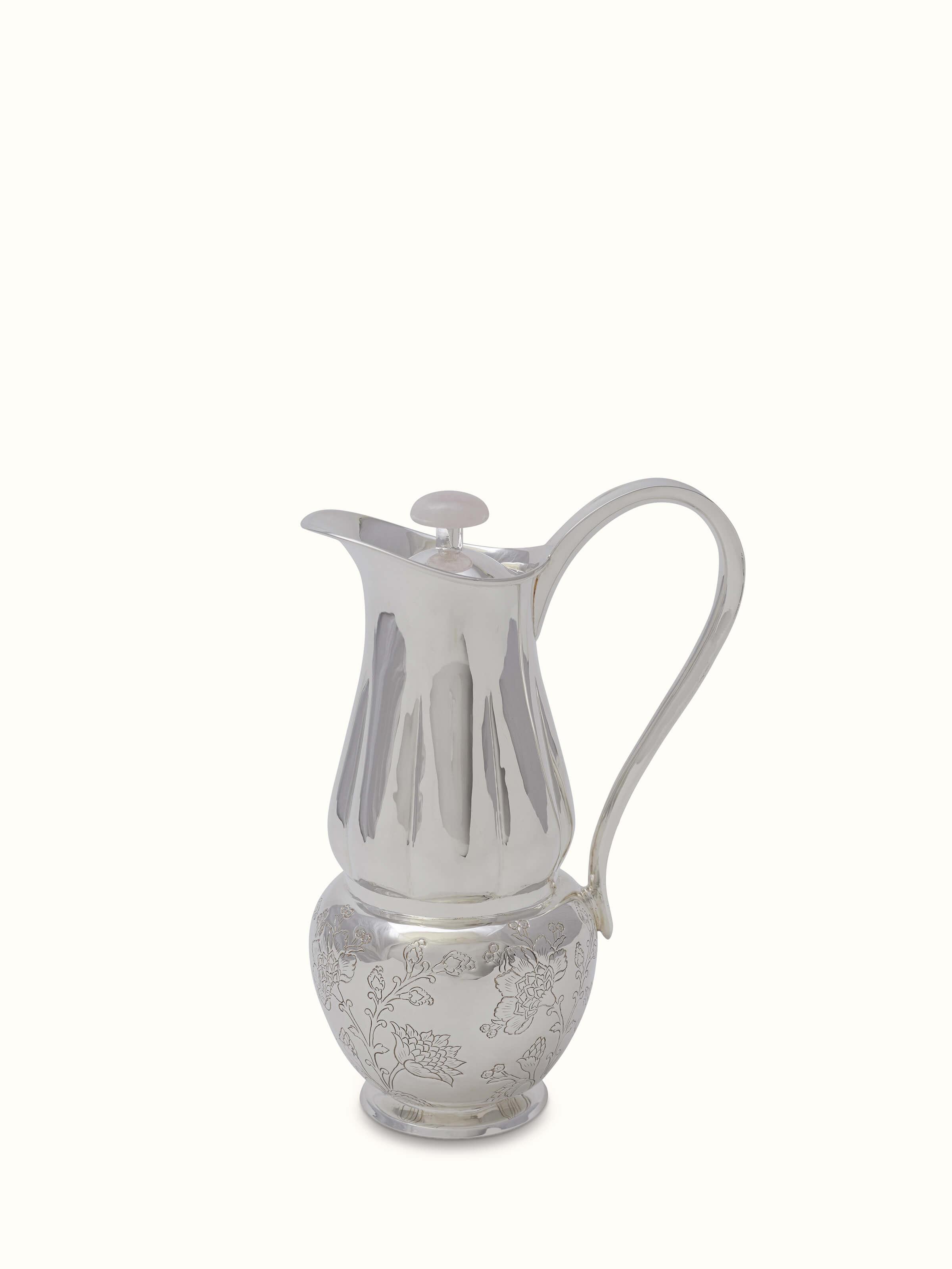 Front view of Kalamkari silver water pitcher showcasing intricate patterns.