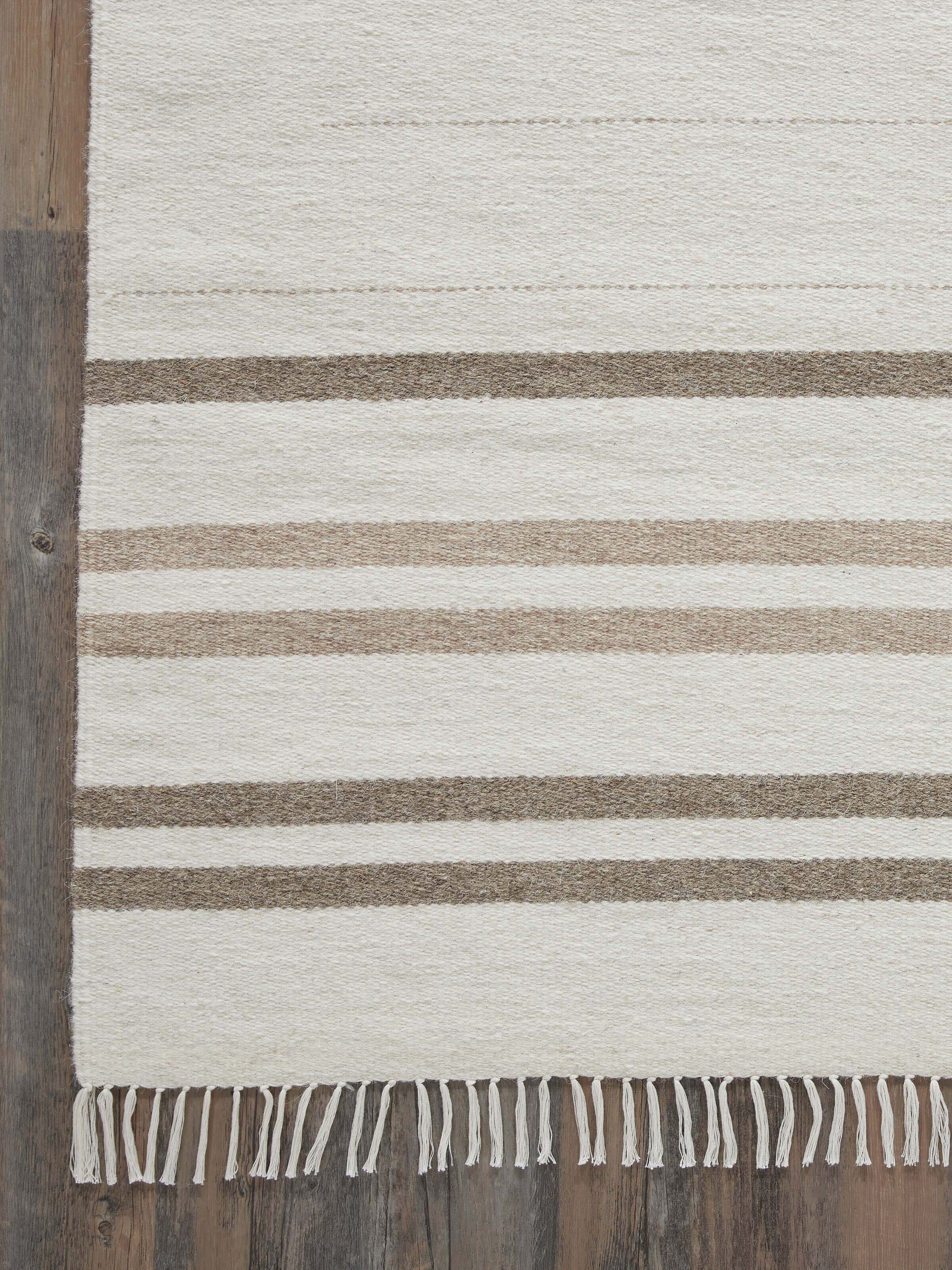 Nomad stripes ivory Jawaja wool & cotton handloom dhurrie, highlighting its stripes and overall texture
