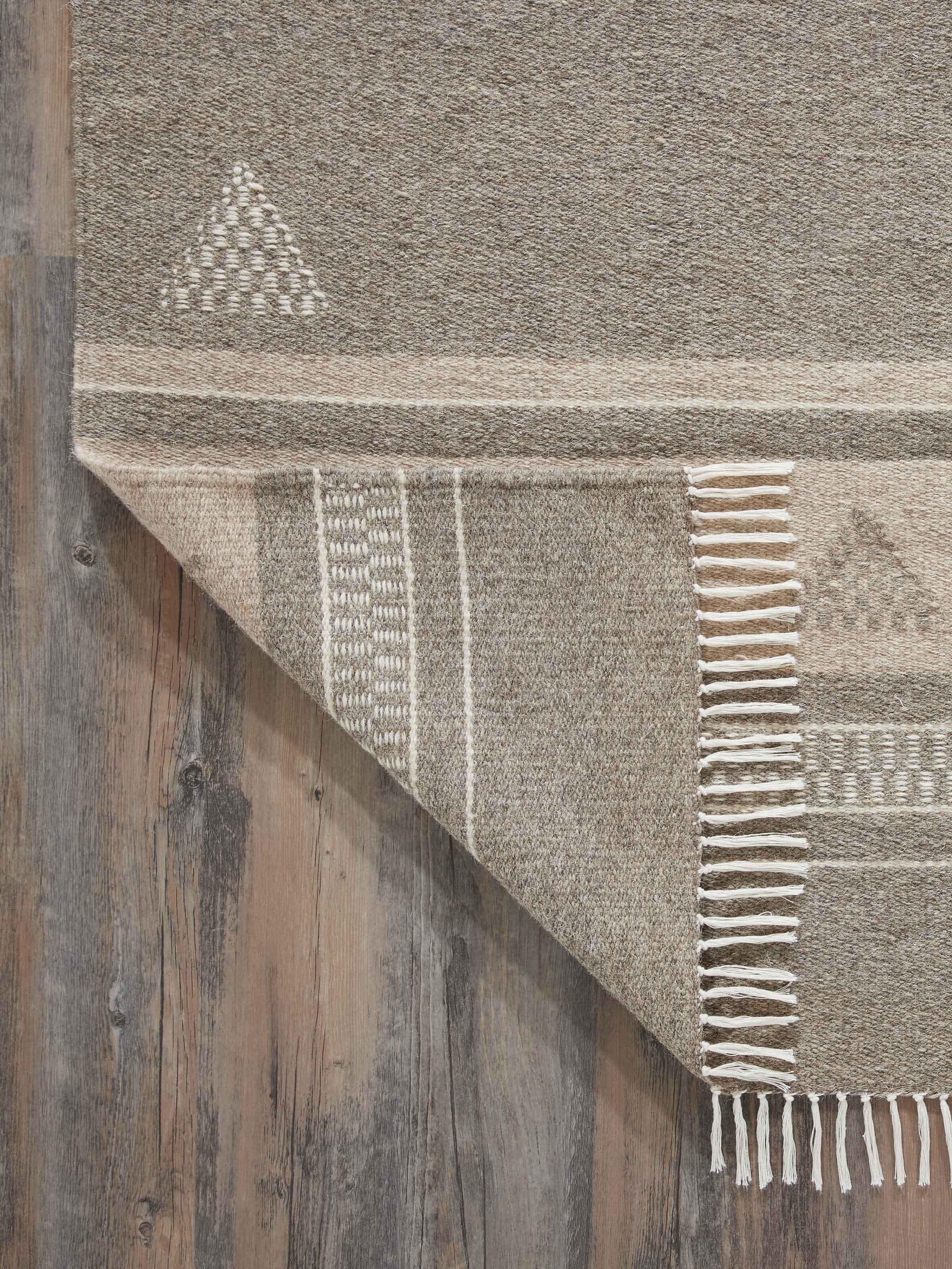 Detailed view of Nomad stripes buti beige Jawaja wool & cotton handloom dhurrie (3x5 ft) focusing on the color contrast and weaving technique.