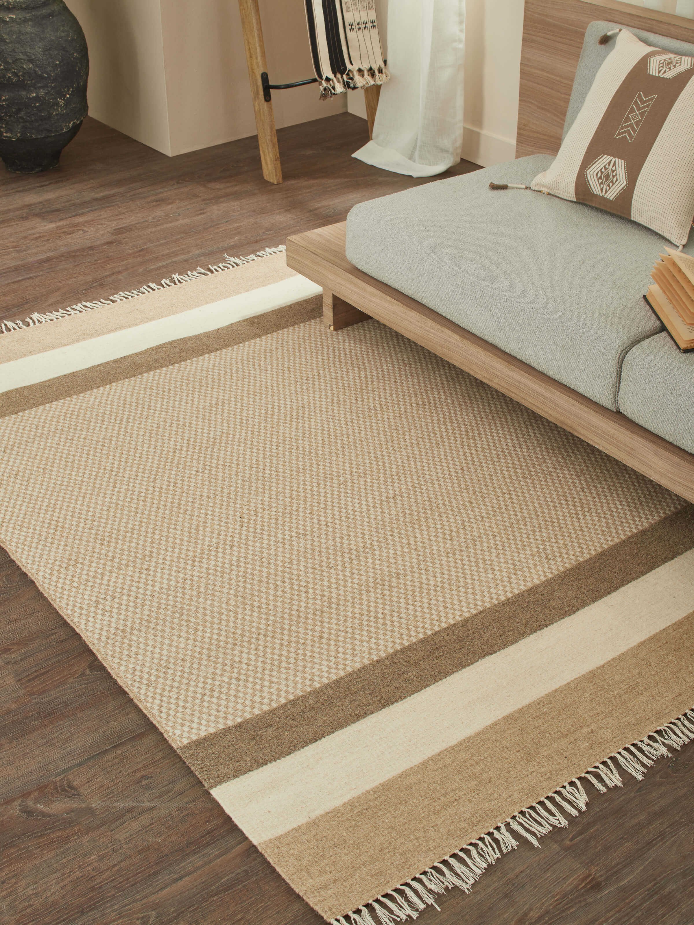 Beige checkered Jawaja wool dhurrie placed in room with modern wood furniture (3x5 ft)
