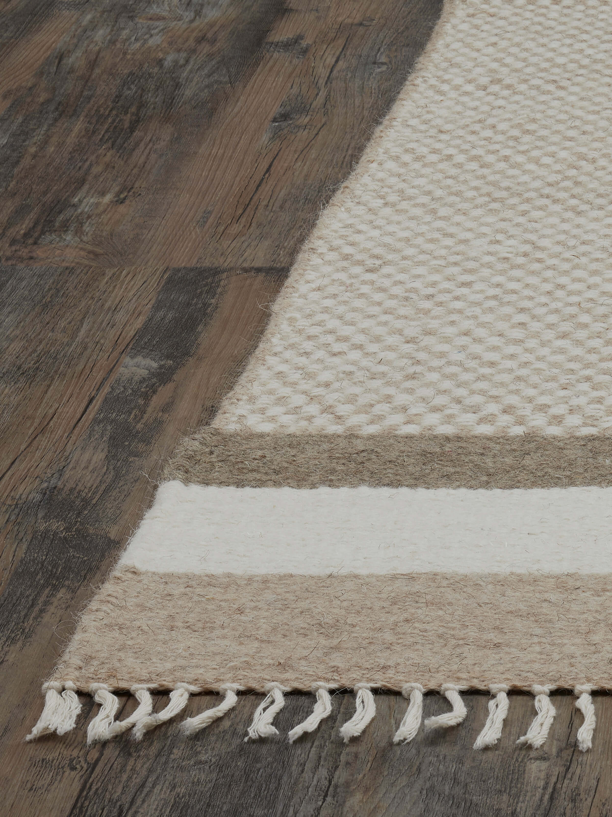 Close-up of Geo checkered beige Jawaja wool & cotton handloom dhurrie (3x5 ft) showing the detailed checkered pattern and texture.