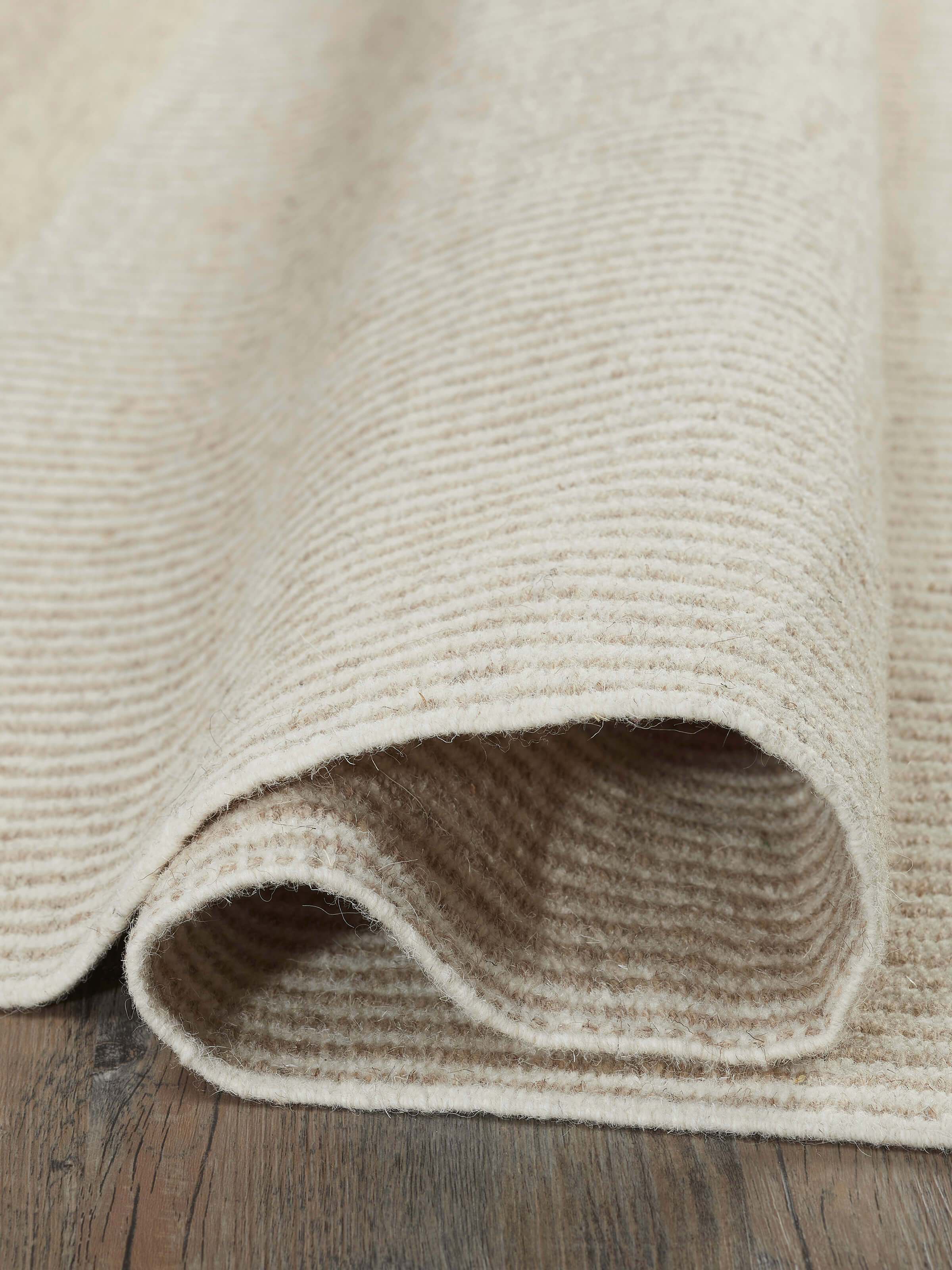 Detailed shot of Textured stripes beige black Jawaja wool & cotton handloom dhurrie (4x6 ft) showing texture and pattern