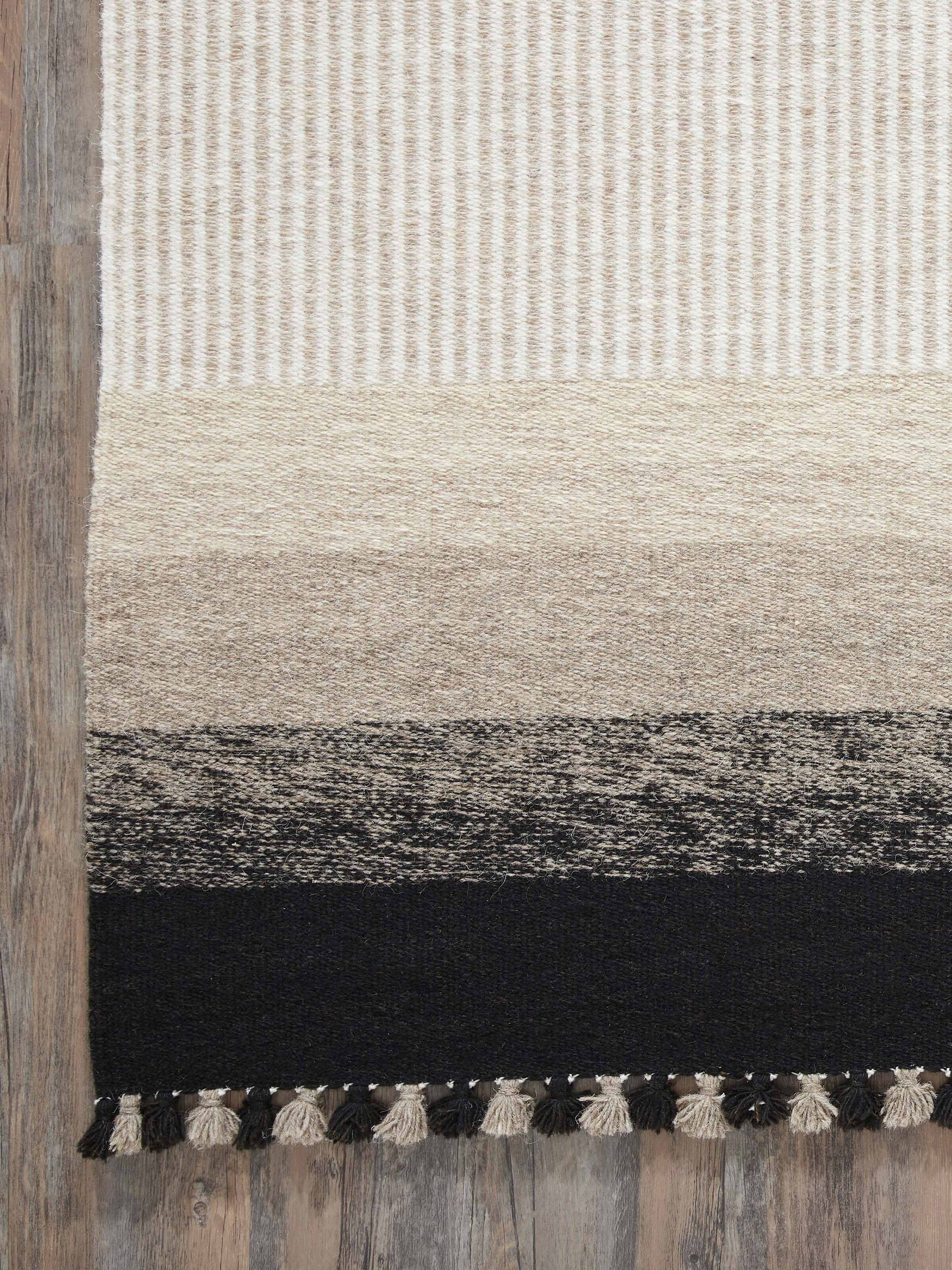 Close-up view of Textured stripes beige black Jawaja wool & cotton handloom dhurrie (4x6 ft) emphasizing the fine weave