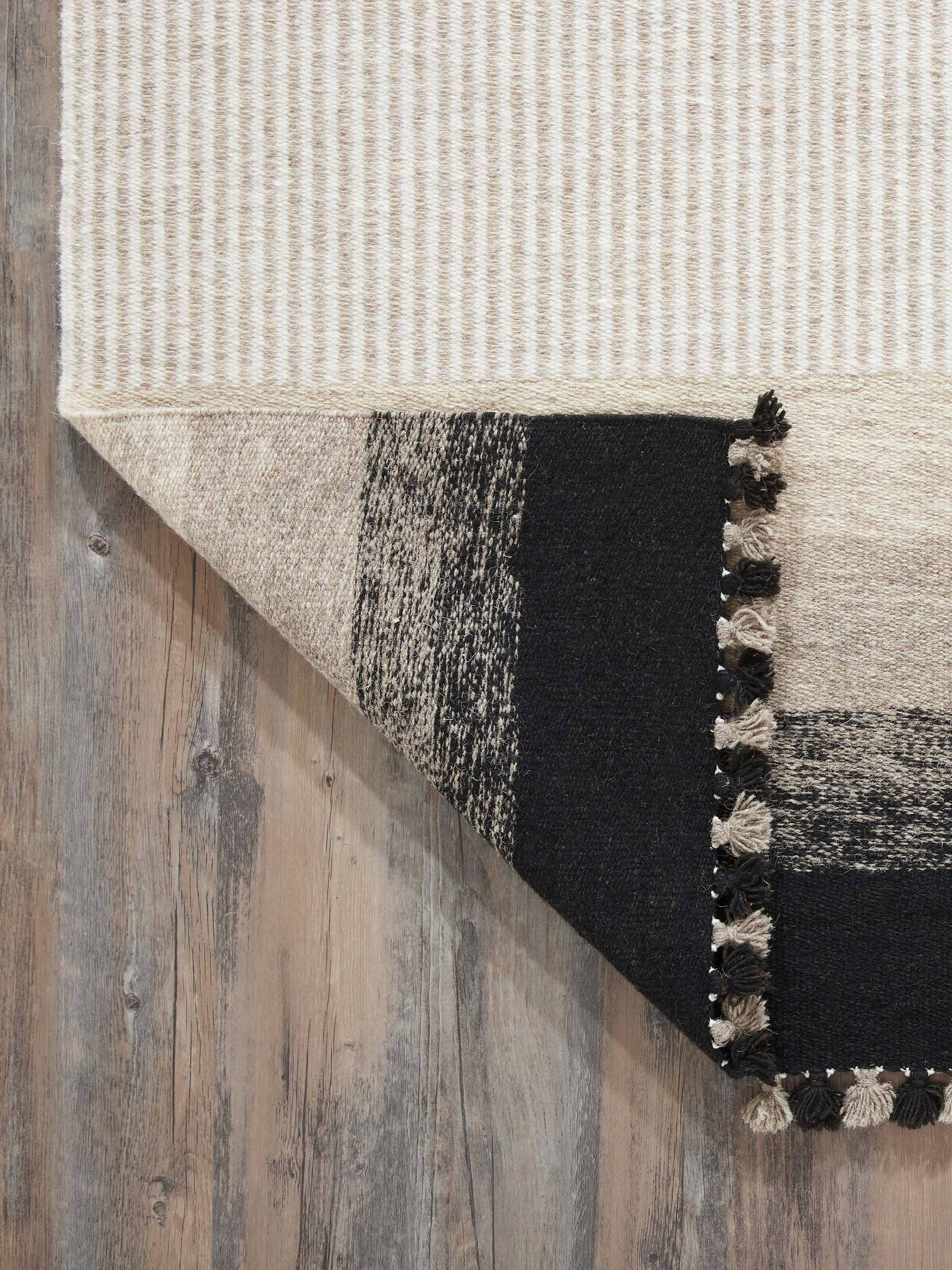 Back view of Textured stripes beige black Jawaja wool & cotton handloom dhurrie (4x6 ft) showing construction and quality