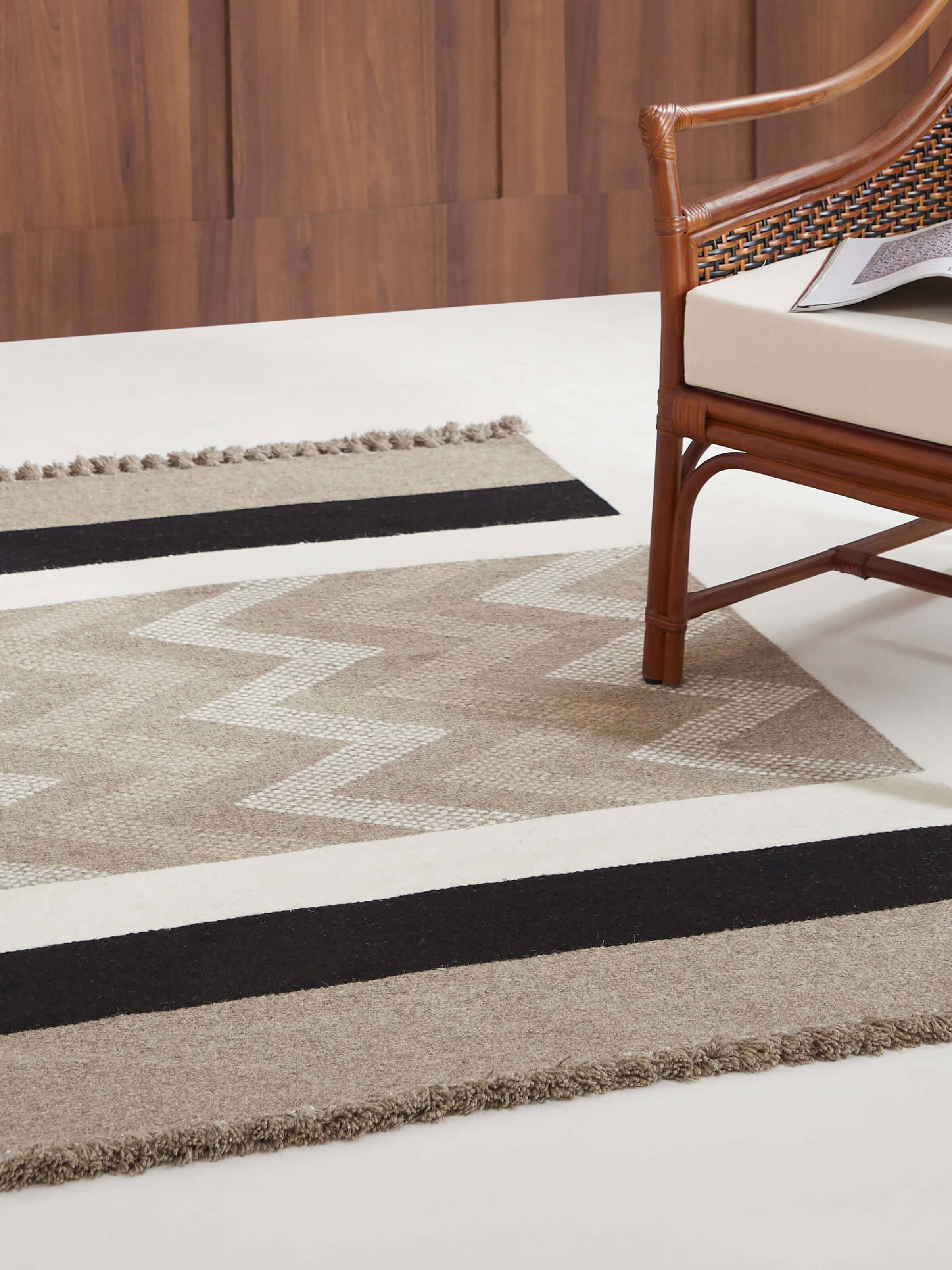 Lifestyle view of Textured Chevron Beige Melange Jawaja Wool Handloom Dhurrie (3X5 Ft), displaying its earthy tones and traditional weave.