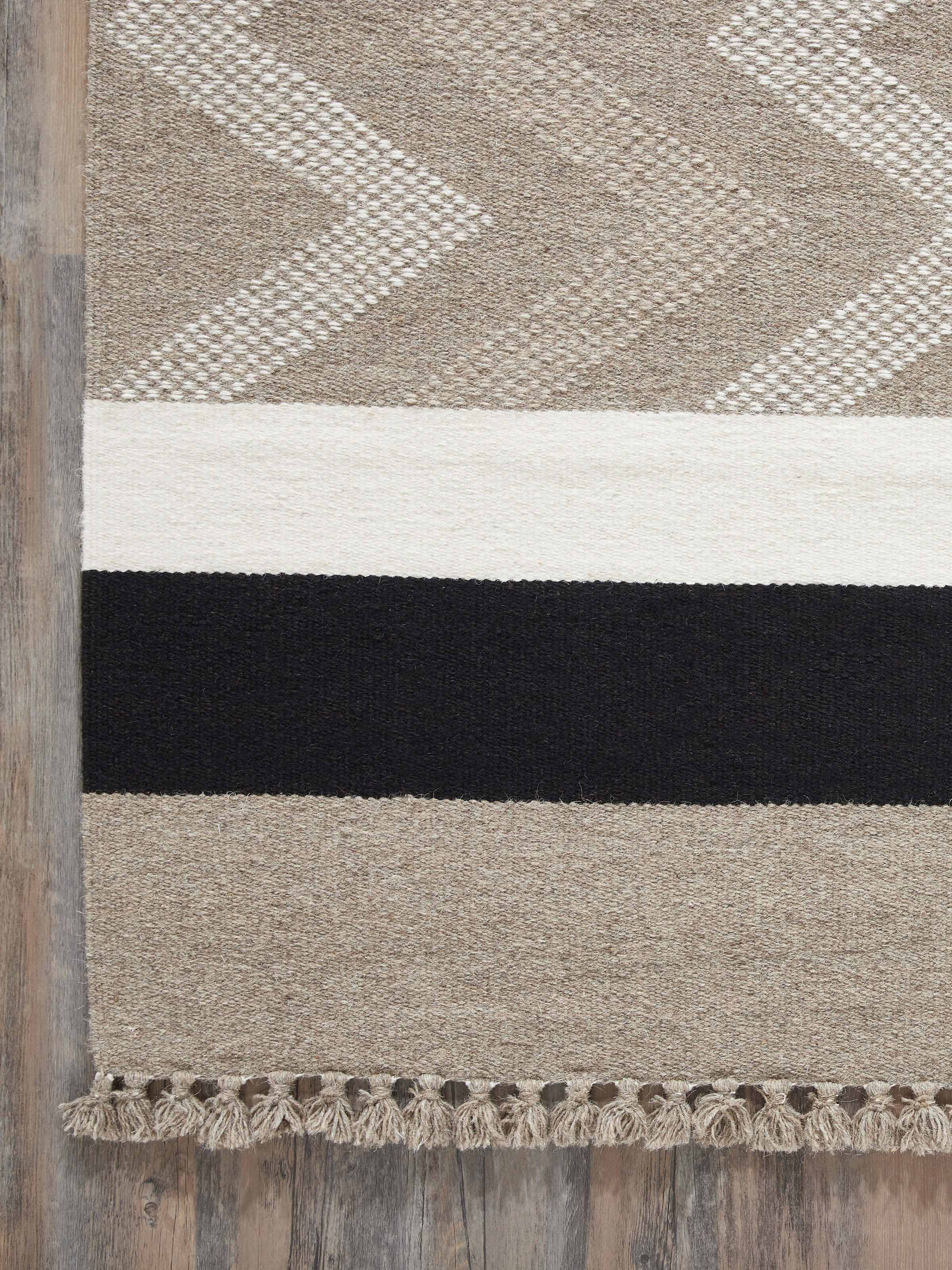 Close-up view of the texture on Textured Chevron Grey Melange Jawaja Wool & Cotton Handloom Dhurrie (3x5 ft), emphasizing the wool and cotton blend.