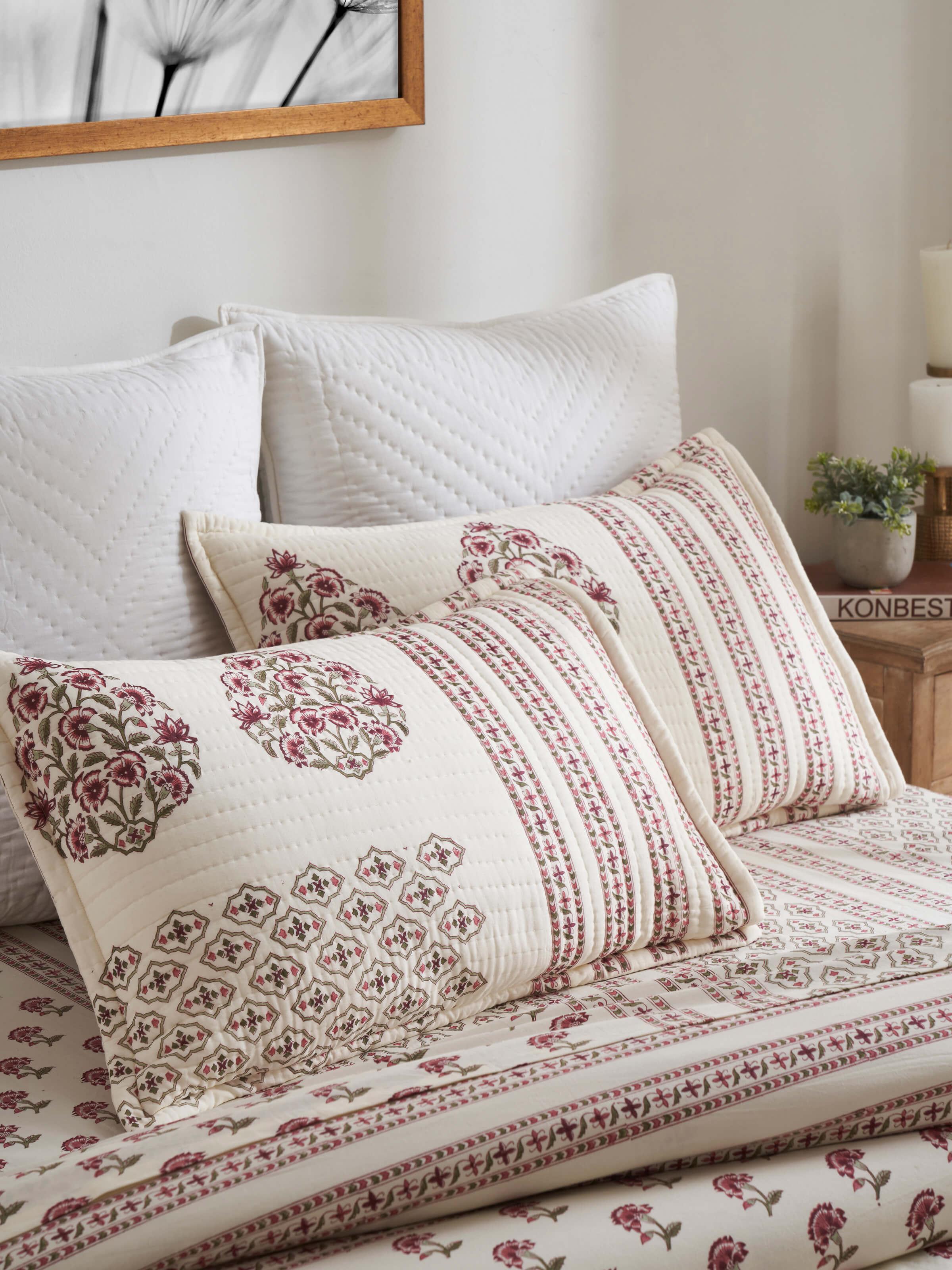 Close-up of Aarunya red floral cotton pillow shams highlighting the detailed Sanganeri block print and vibrant color.