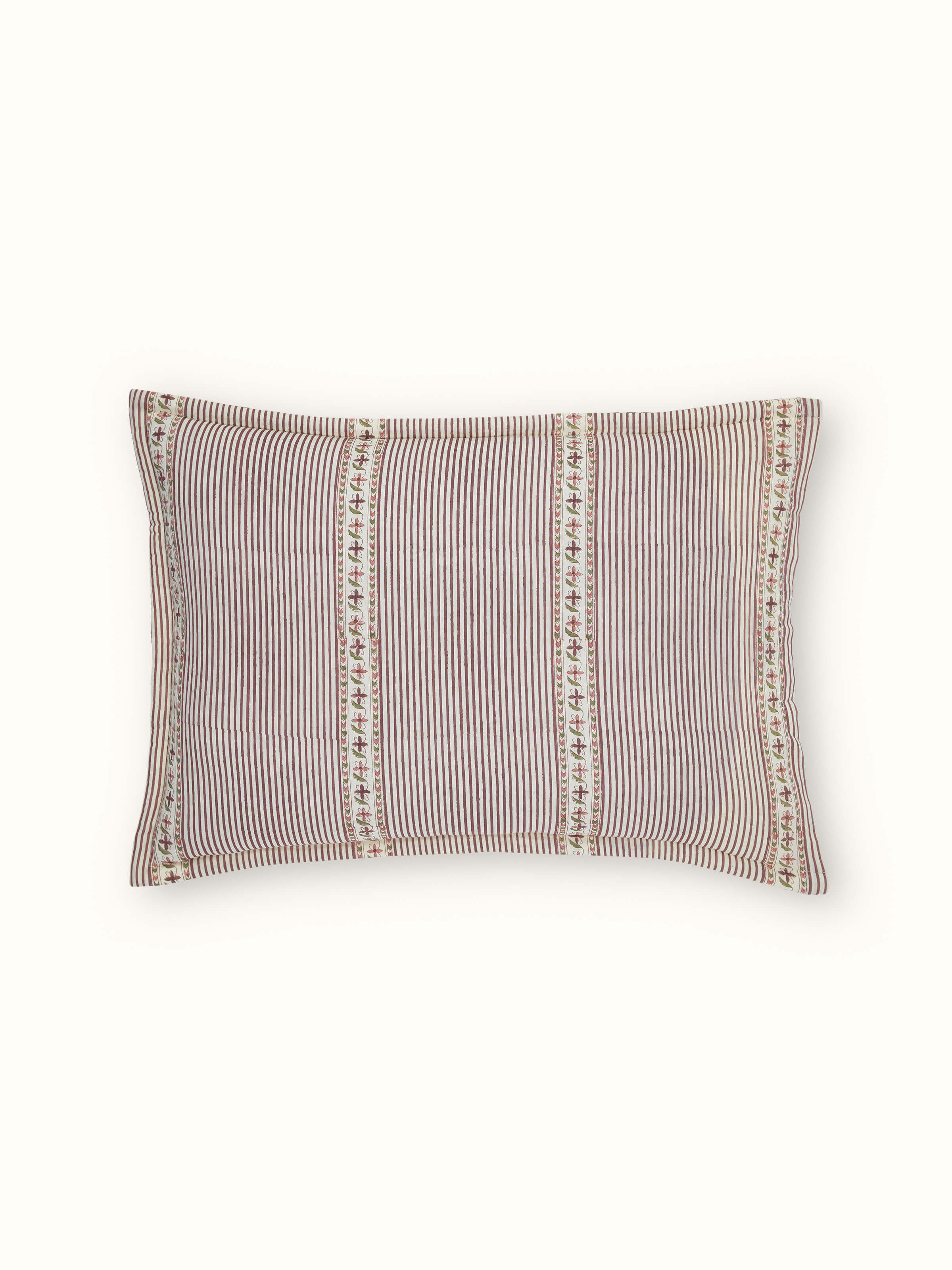 Aarunya red floral cotton pillow shams arranged to highlight the repeating Sanganeri block print pattern and color contrast.