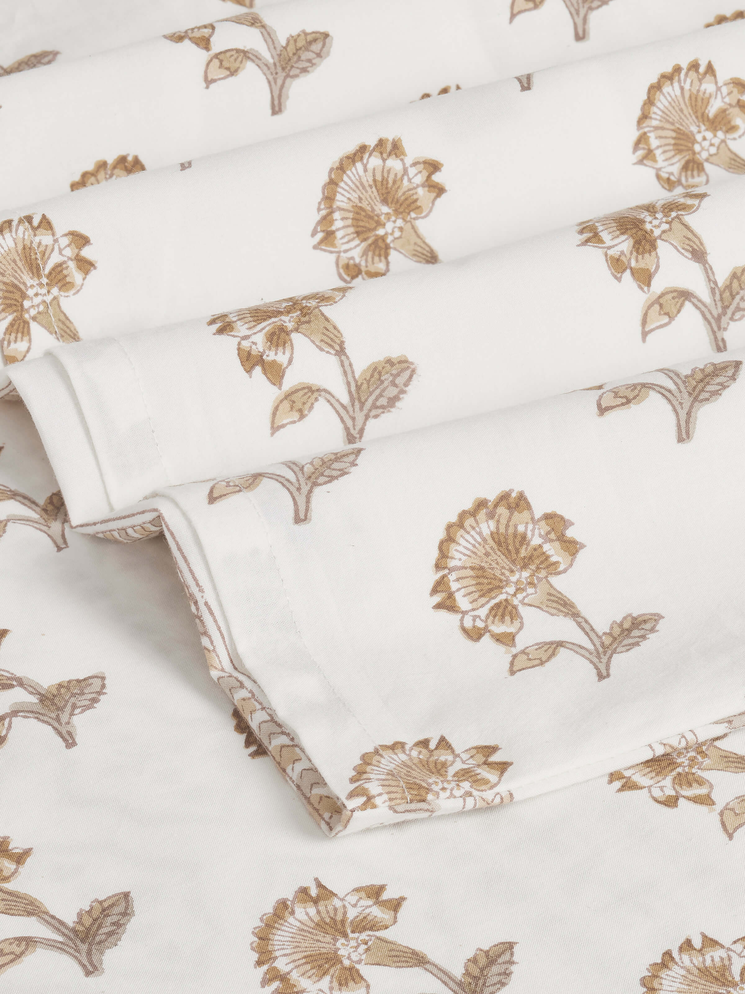 Detailed view of Aarunya Beige Floral Cotton Sanganeri Block Printed King Bedsheet Set, highlighting the floral print and fabric.