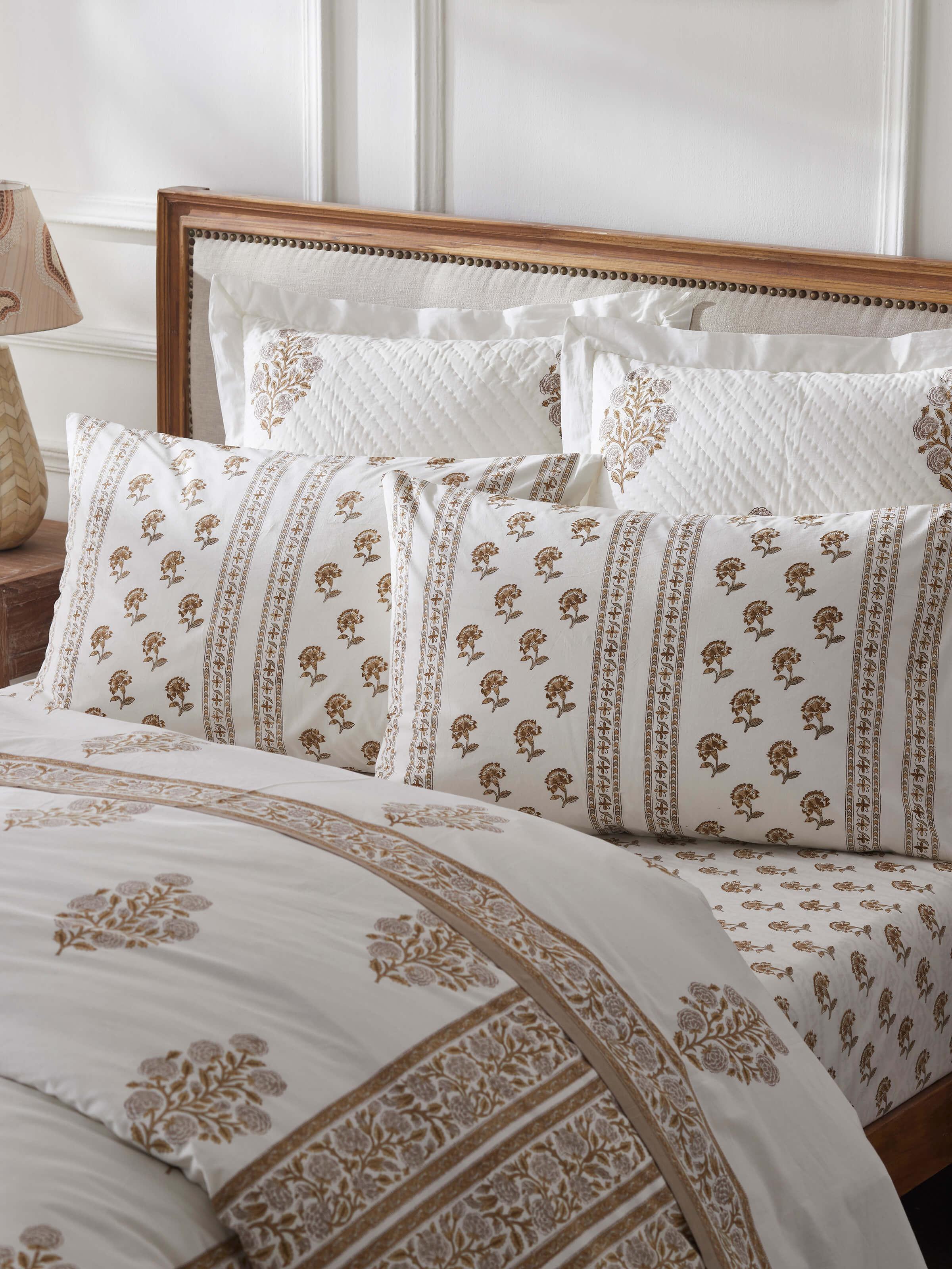 Close-up view of Aarunya beige buti cotton pillow cases showcasing intricate Sanganeri block print