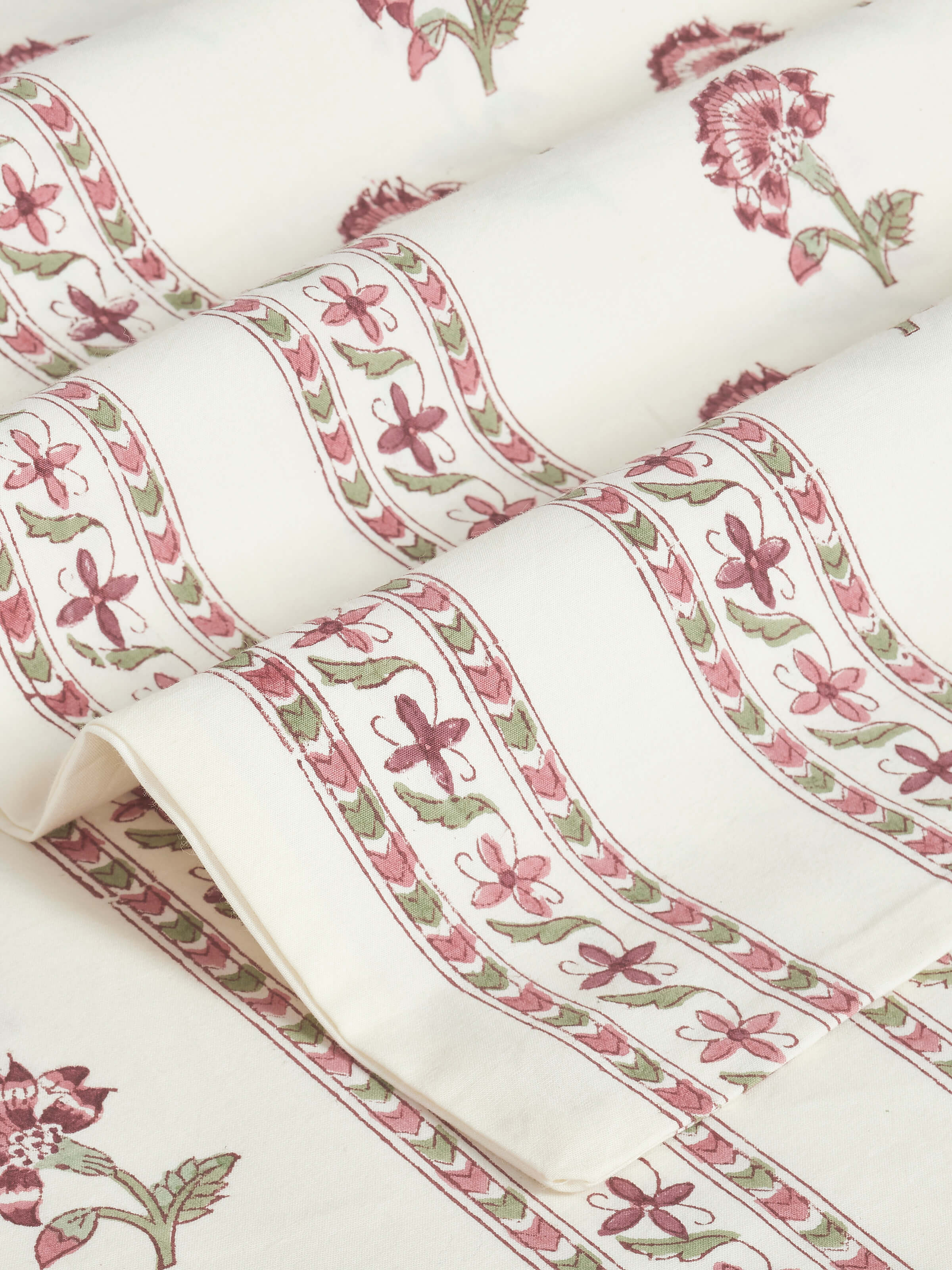 Perspective view of Aarunya red buti cotton Sanganeri block printed queen bedsheet set (3 pcs) displaying the overall design and texture.