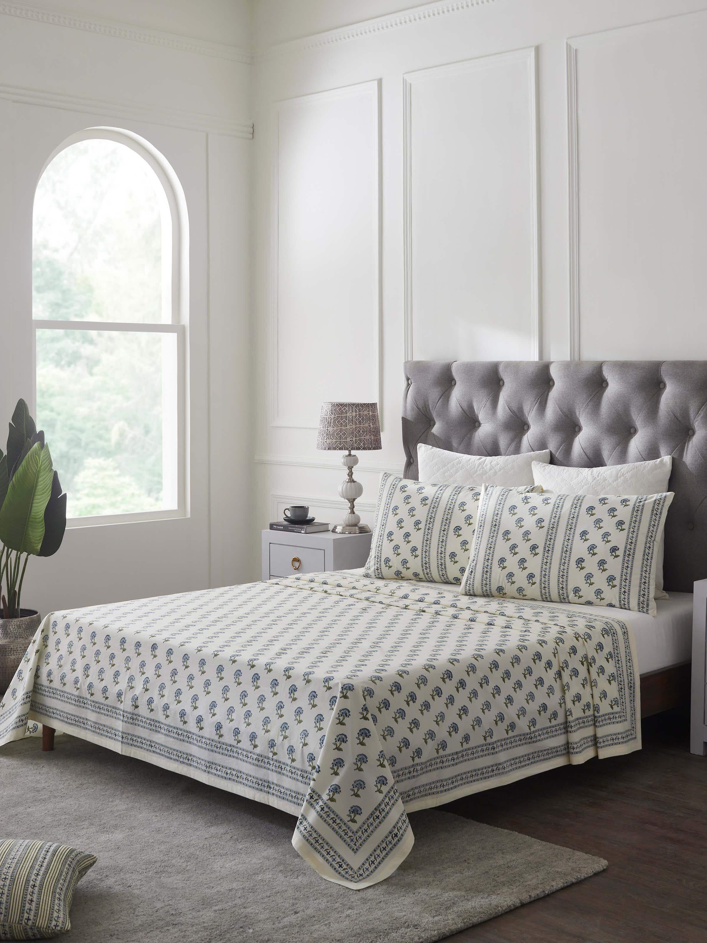 Side view of Aarunya blue buti cotton king bedsheet set, highlighting the block print pattern