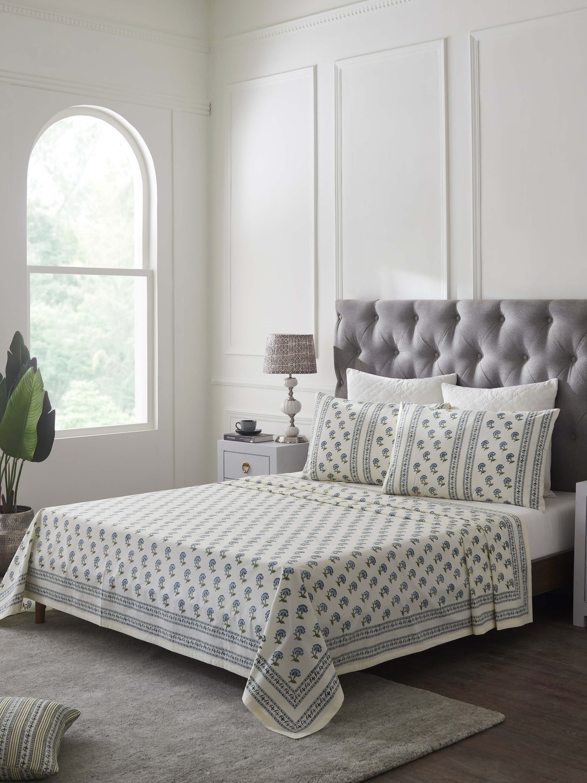 Side view of Aarunya Blue Buti Cotton Sanganeri Block Printed Queen Bedsheet Set (3 pcs) highlighting the bedsheet's design and print.