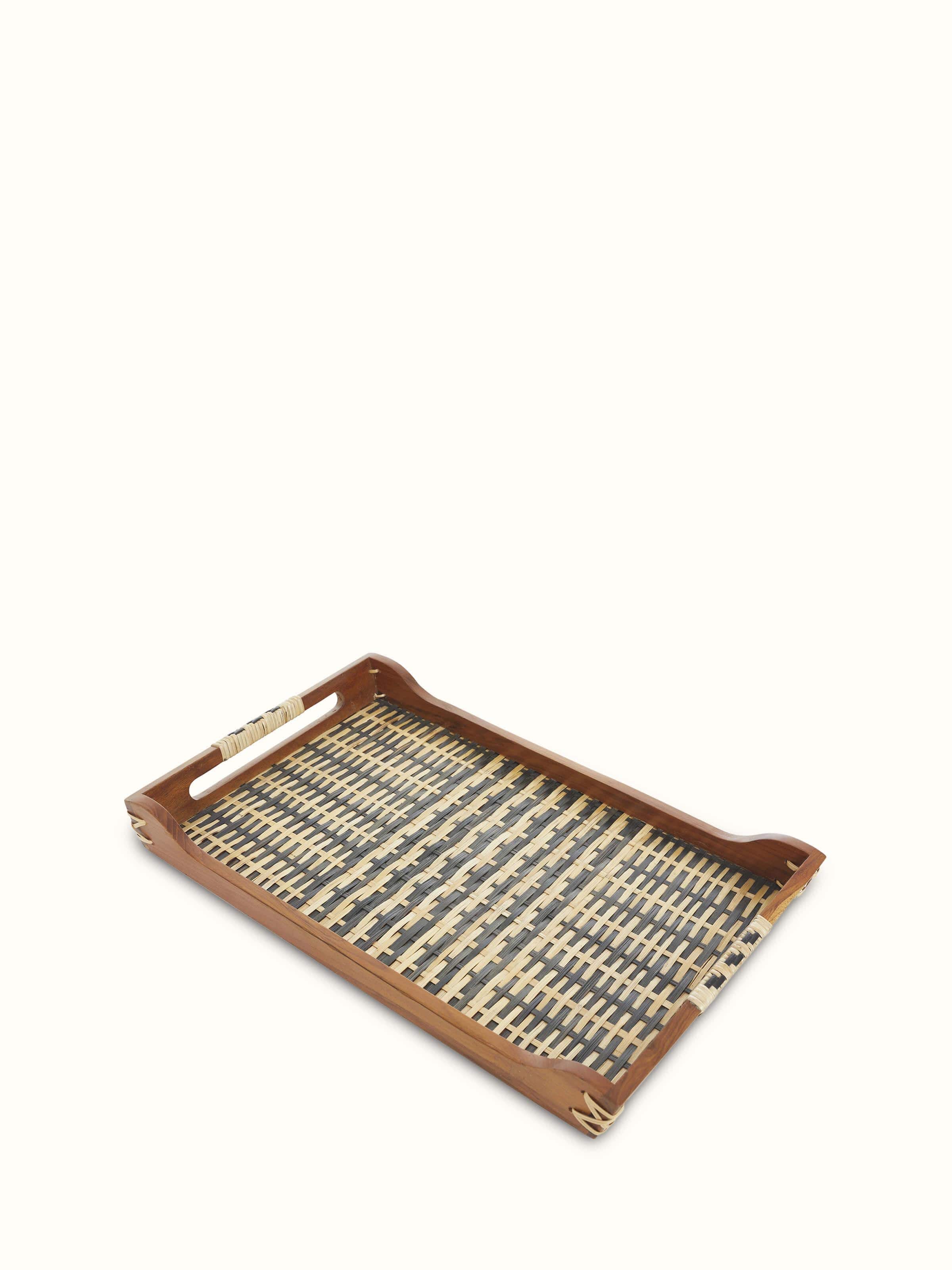 Close-up of bamboo and teak wood decorative tray, focusing on the detailed wood carvings and finish.