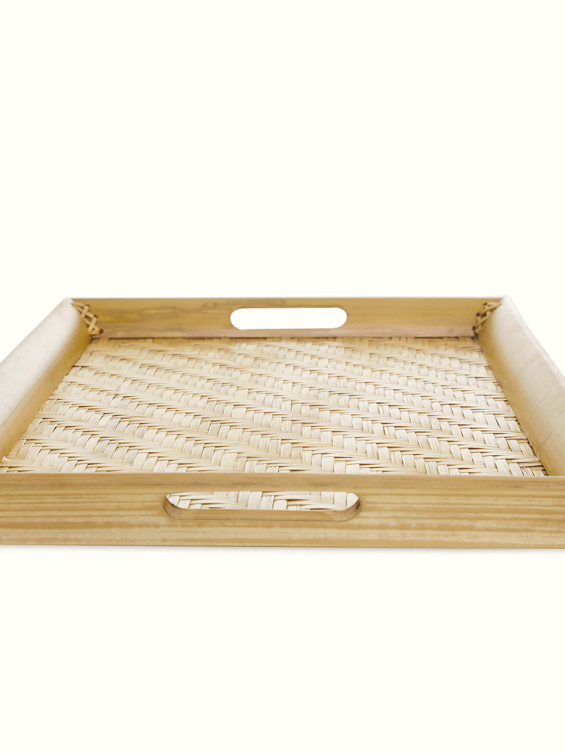 Angled view of Bamboo Tray showing the sturdy construction and natural bamboo color.