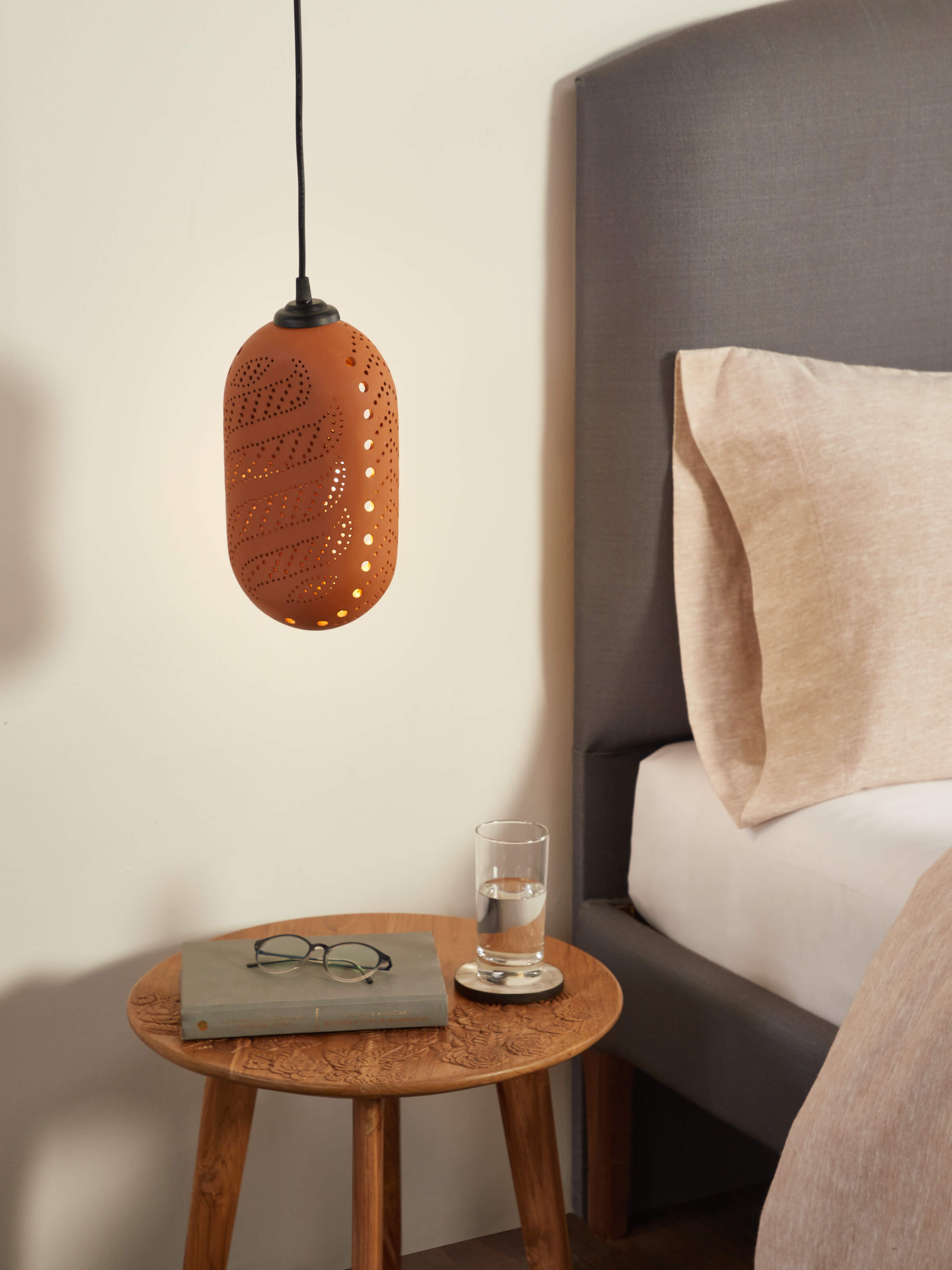Side view of large terracotta pendant lights (2 pcs), showing their elegant shape and texture.