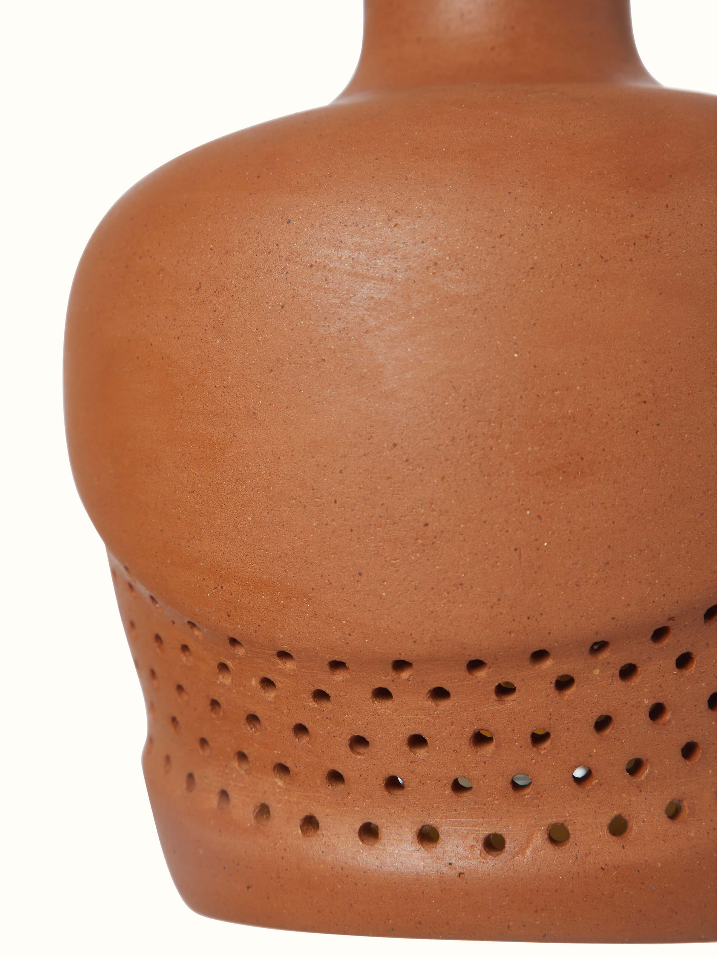 Another angle of terracotta pendant lights, showing the elegant design and practical use in interior decor.