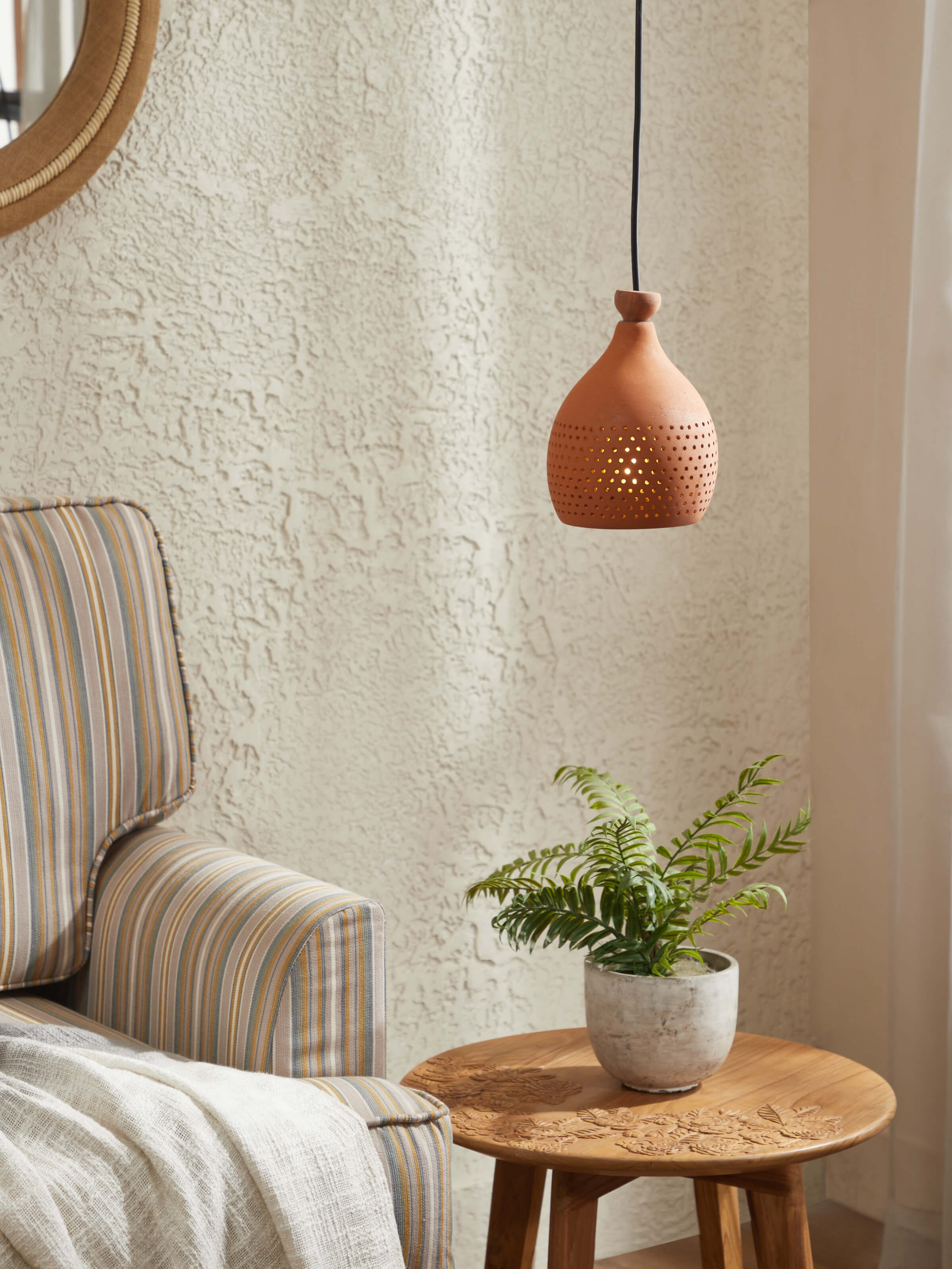 Side view of Natural Terracotta Pendant Lights (Small), showcasing the shape and hanging details