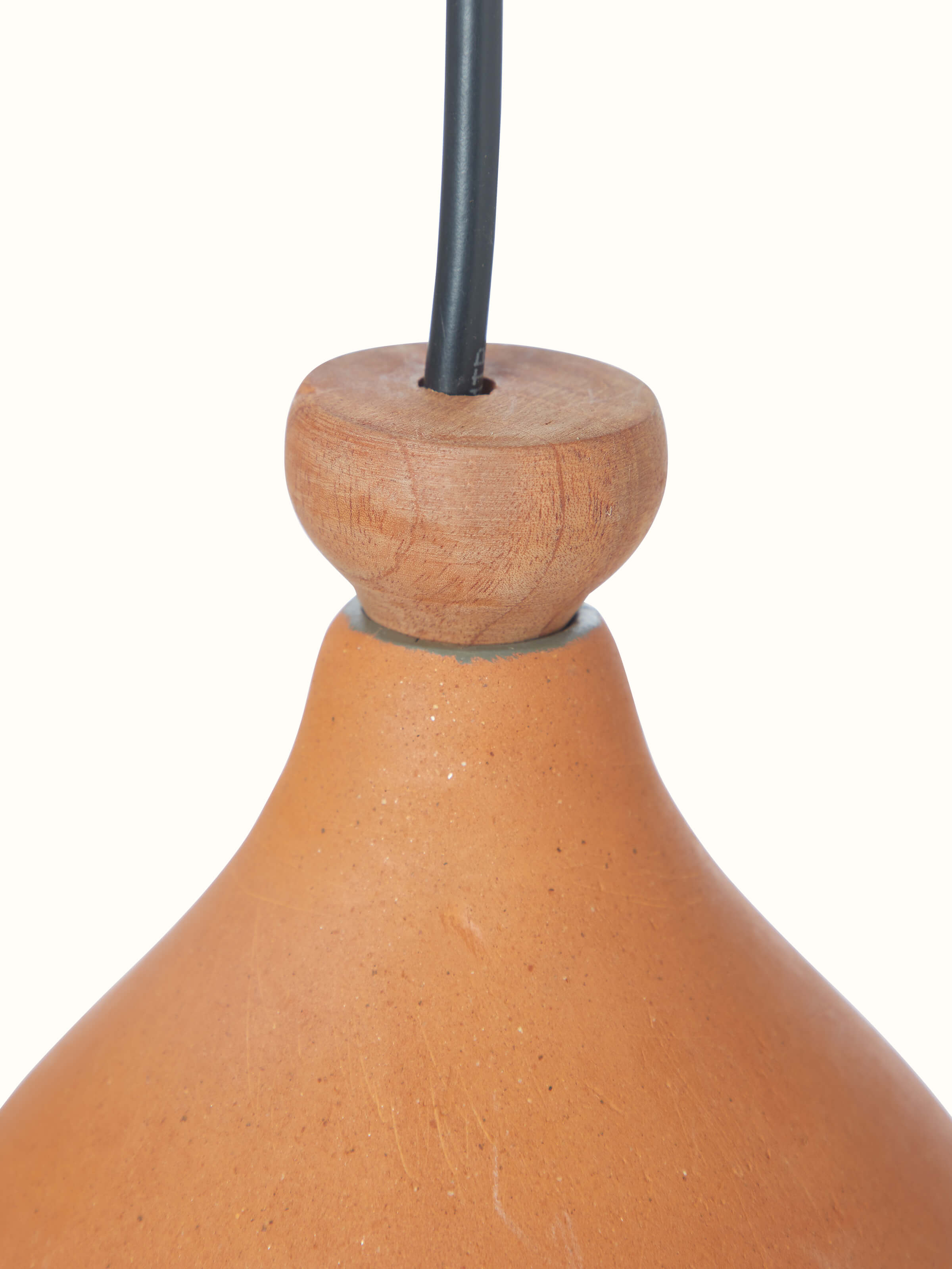 Angled view of Natural Terracotta Pendant Lights (Small), illustrating the terracotta’s texture and light diffusion