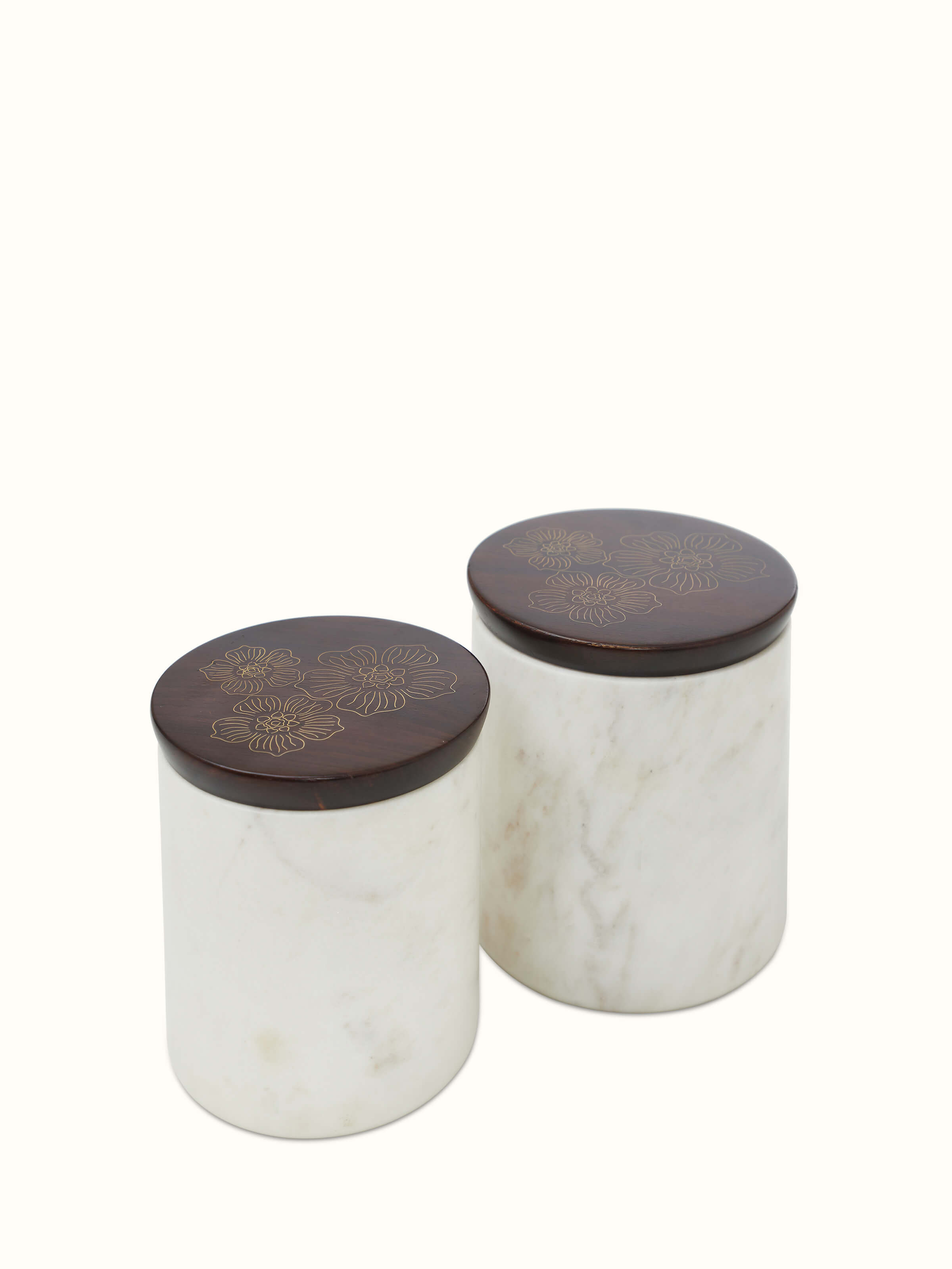 Close-up of Tarkashi sheesham wood and brass jars, showcasing intricate Tarkashi work and brass accents.