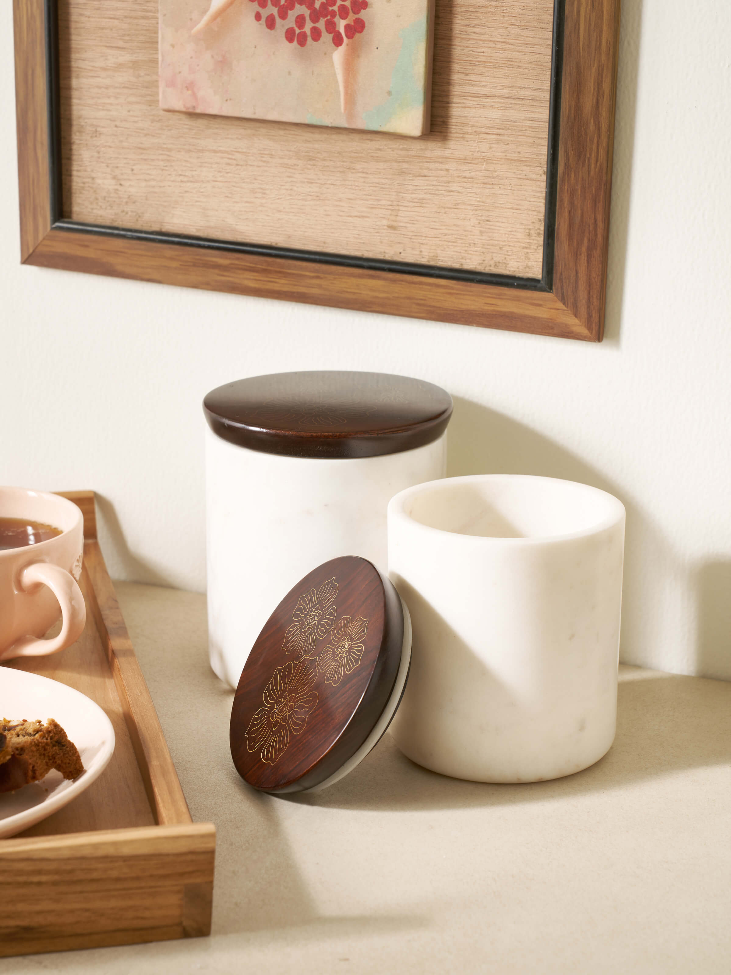Detailed view of Tarkashi sheesham wood and brass jars highlighting the fine craftsmanship and design.