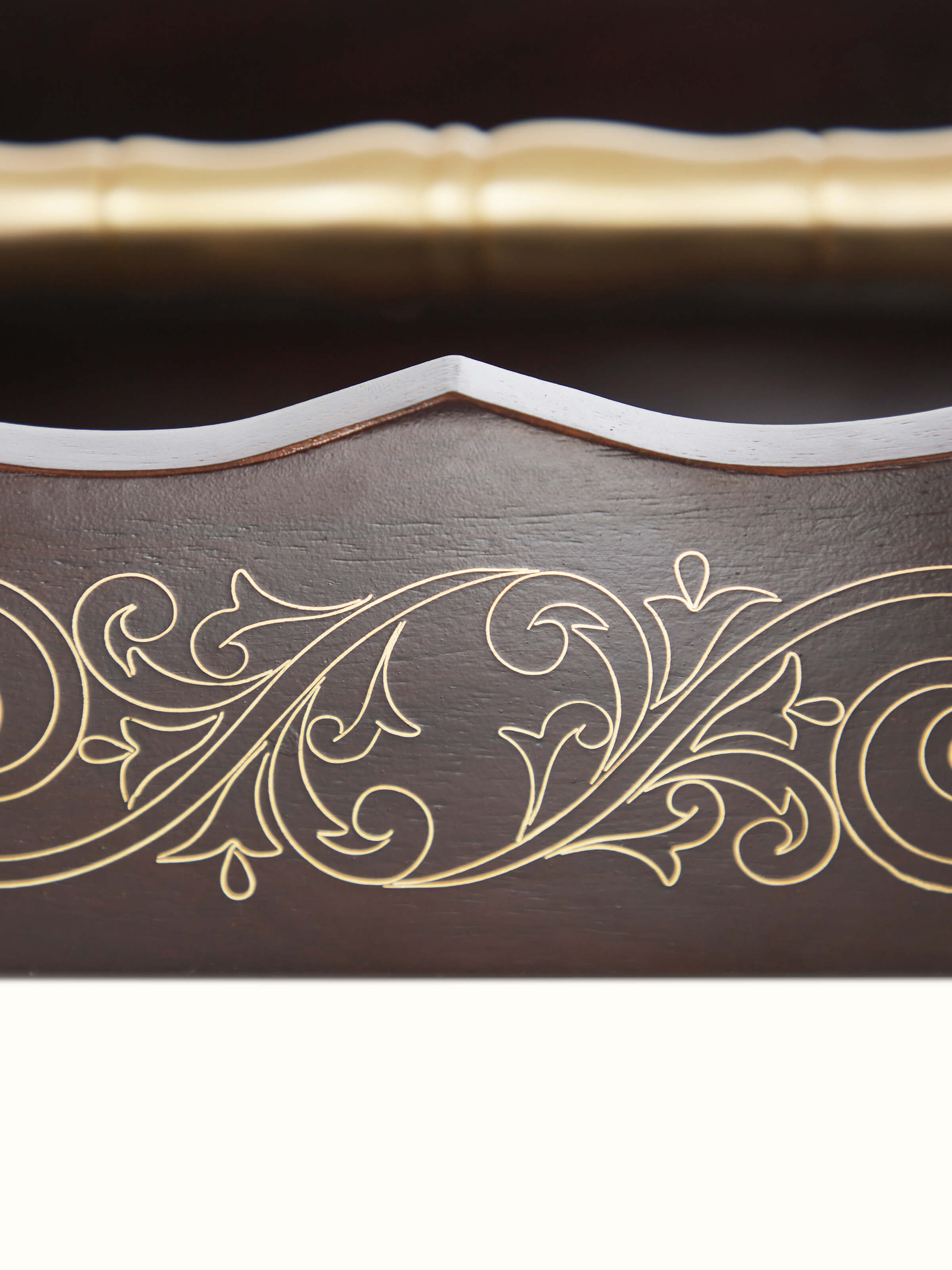 Detailed view of Tarkashi Sheesham wood & brass napkin holder emphasizing the rich wood texture and intricate brass detailing