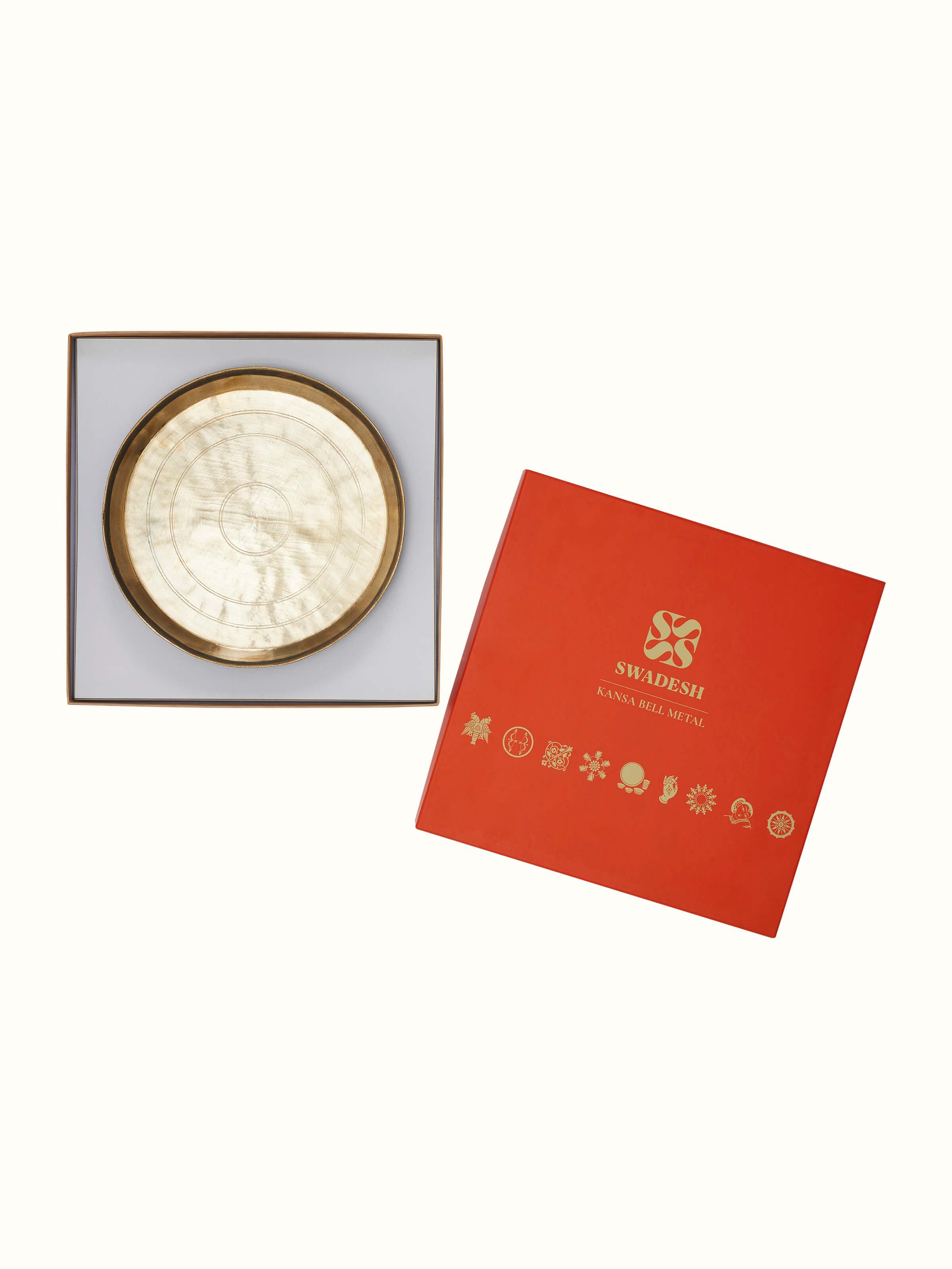 Angled view of Bell Metal Dinner Plate (11 inches) showing its elegant curvature and metal finish.