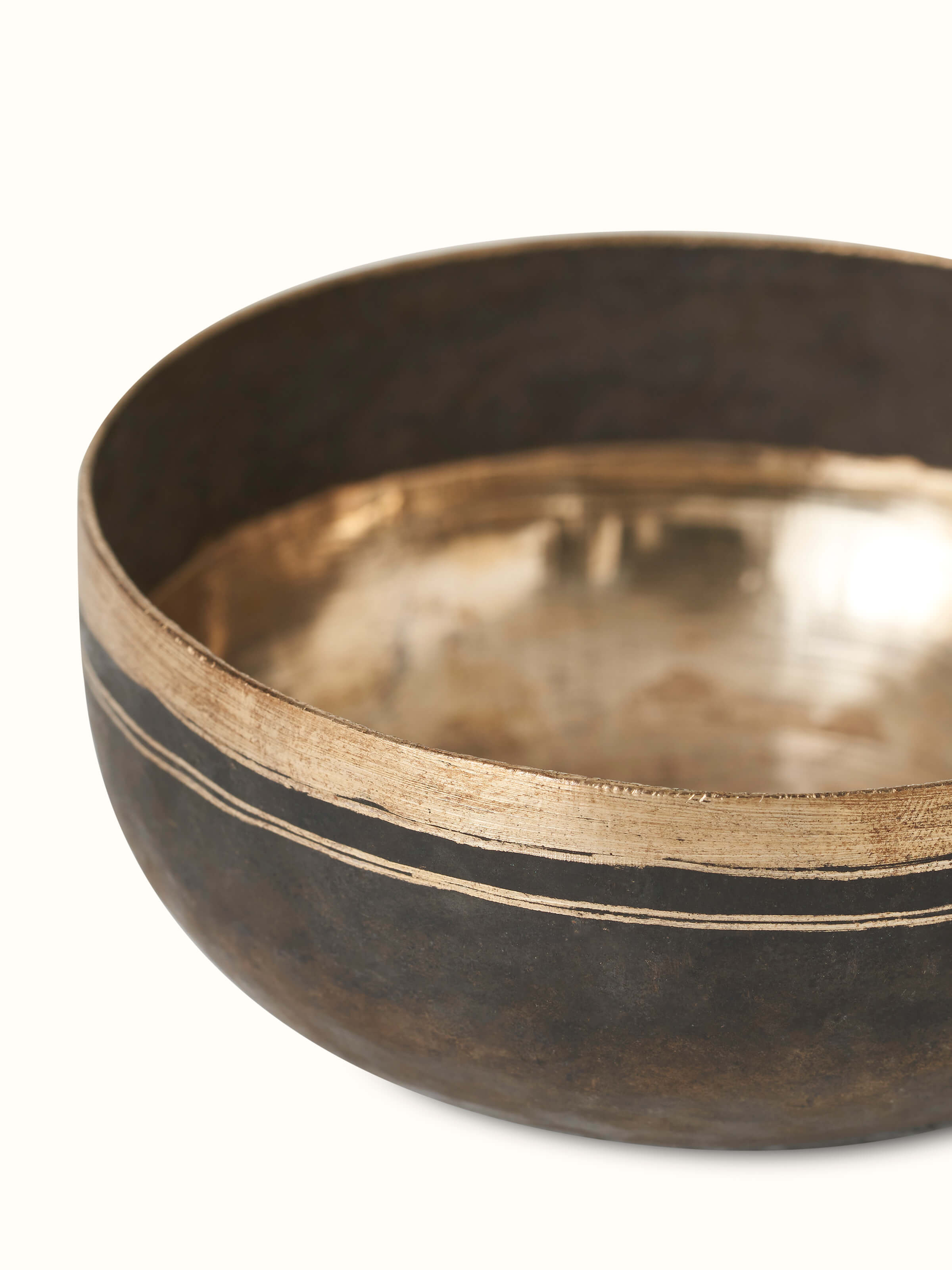 Side angle view of Bell metal dinner bowls highlighting the elegant contours.