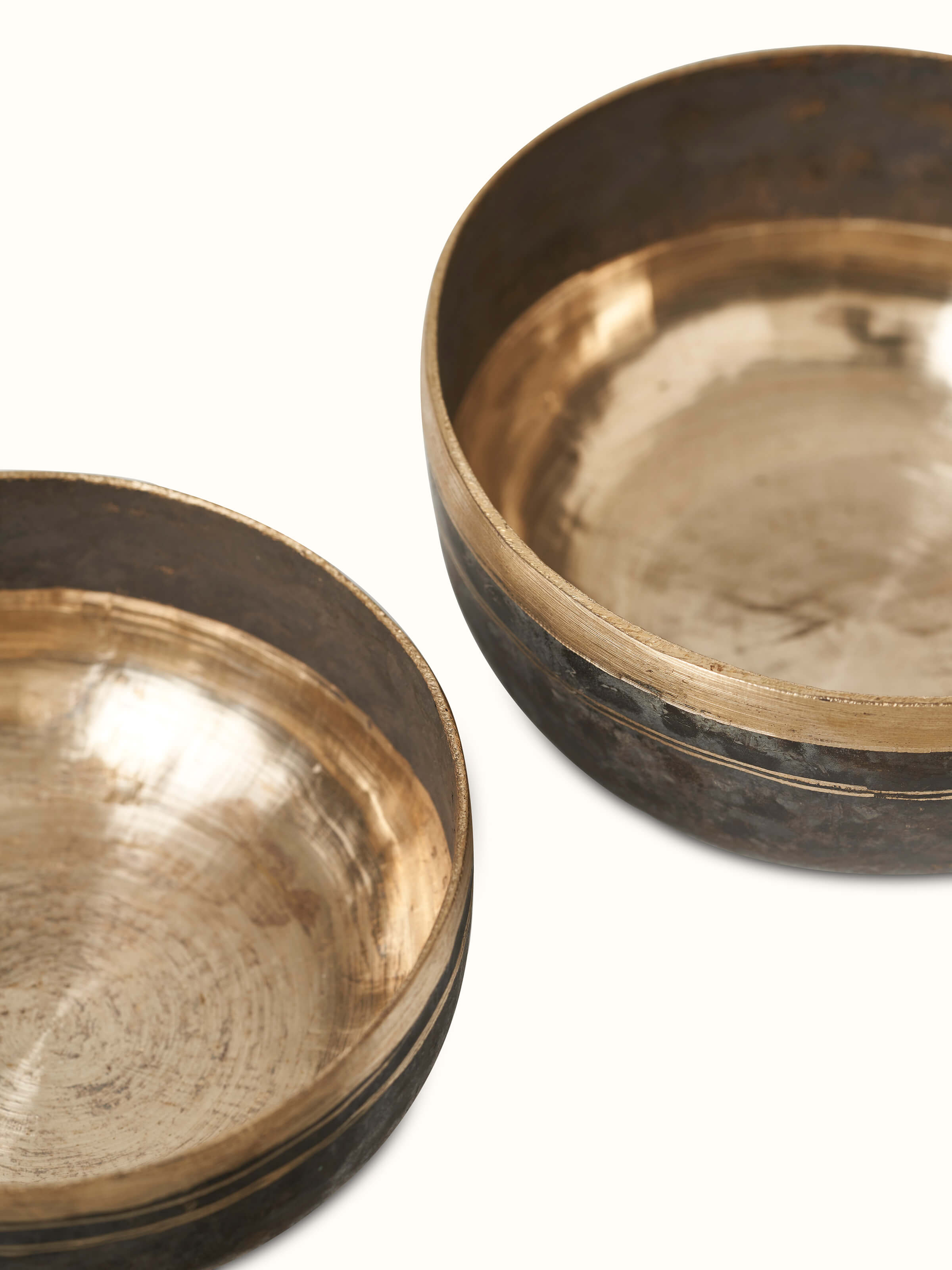 Detailed close-up of Bell metal dinner bowls featuring unique metallic sheen.