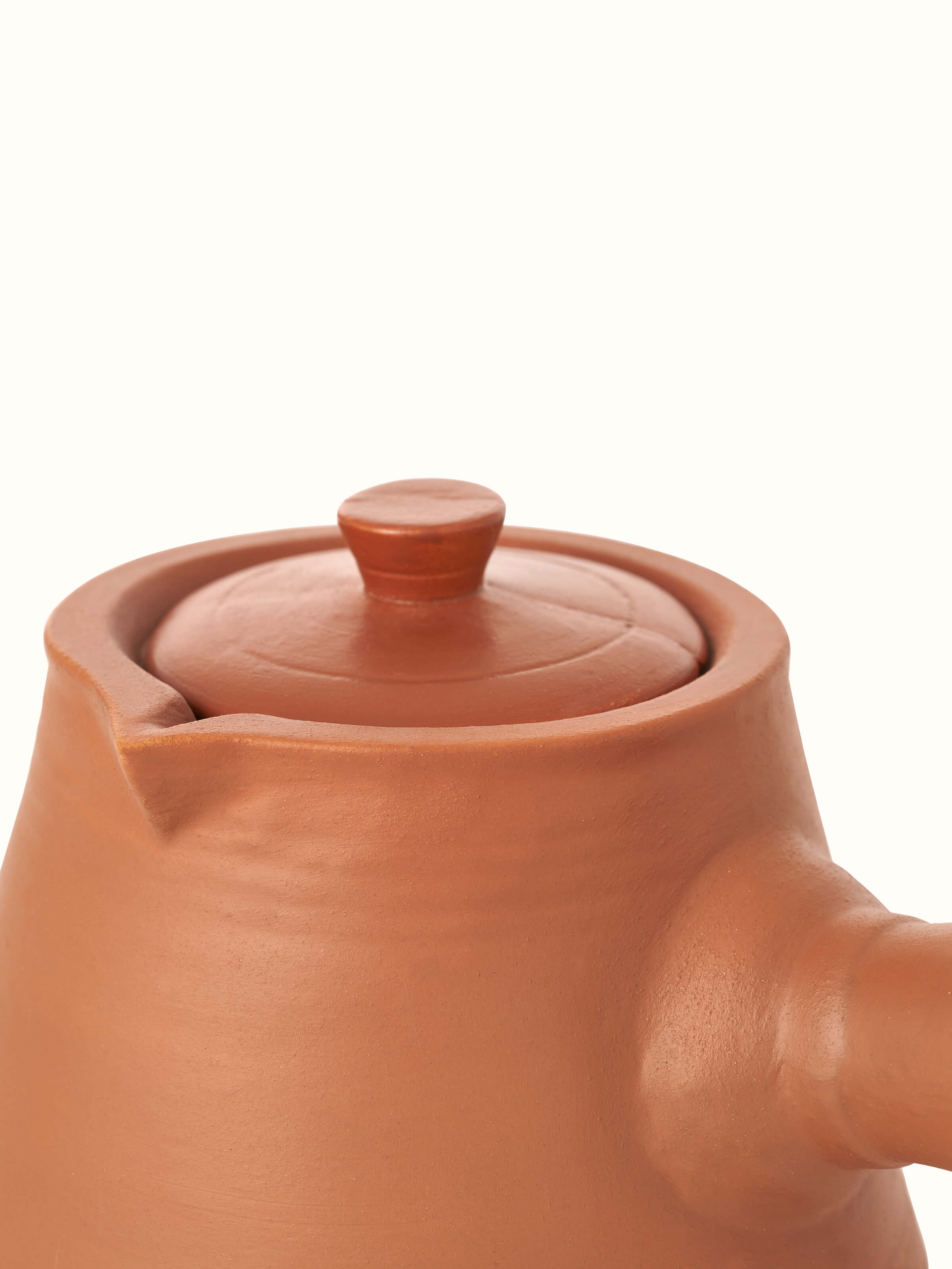 Top view of terracotta clay saucepan, highlighting its functional design and rustic appeal.