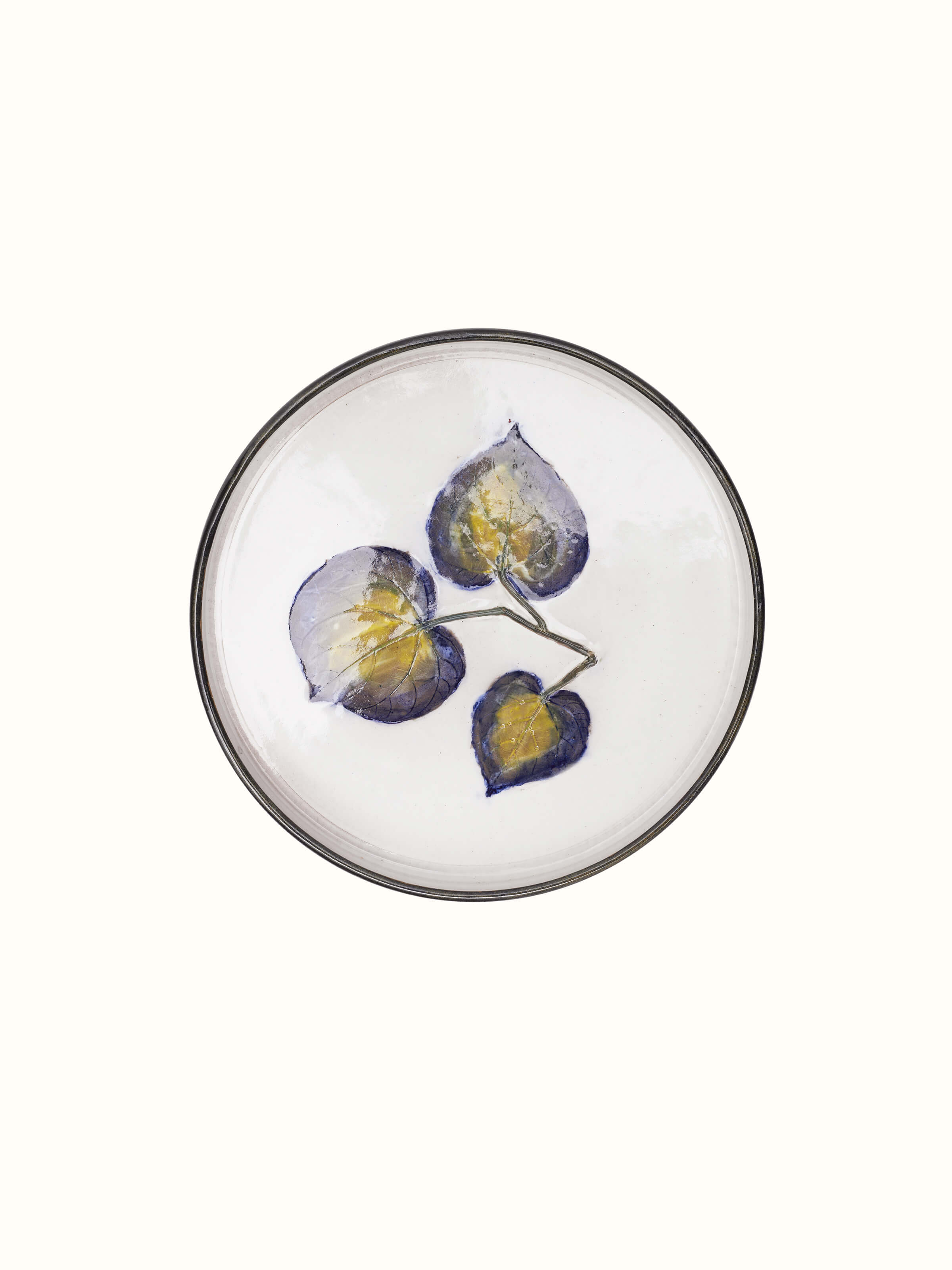 Angled view of Glazed studio pottery ceramic dinner plate emphasizing its elegant shape and finish