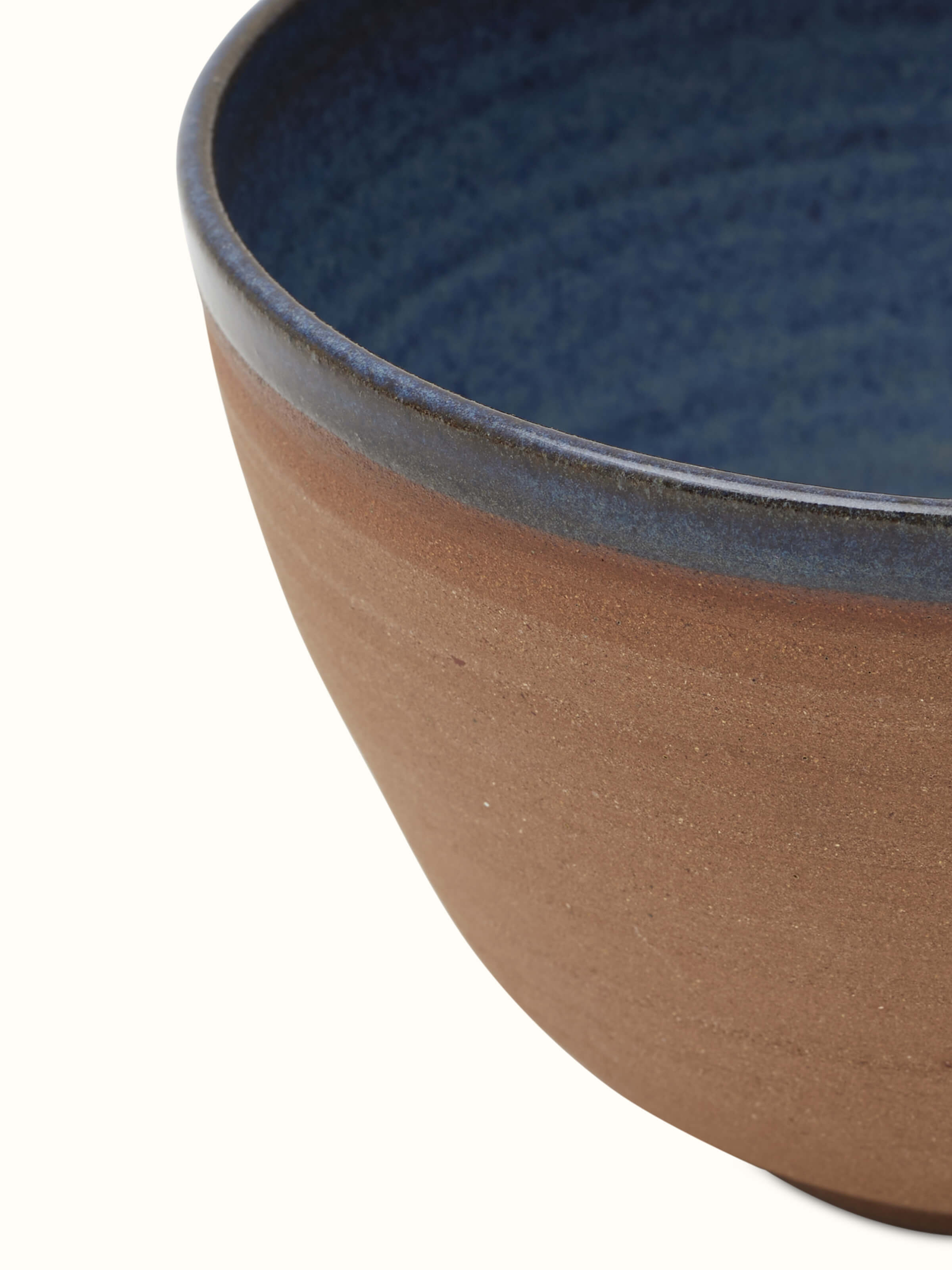 Side view of Studio pottery ceramic serving bowl in brown