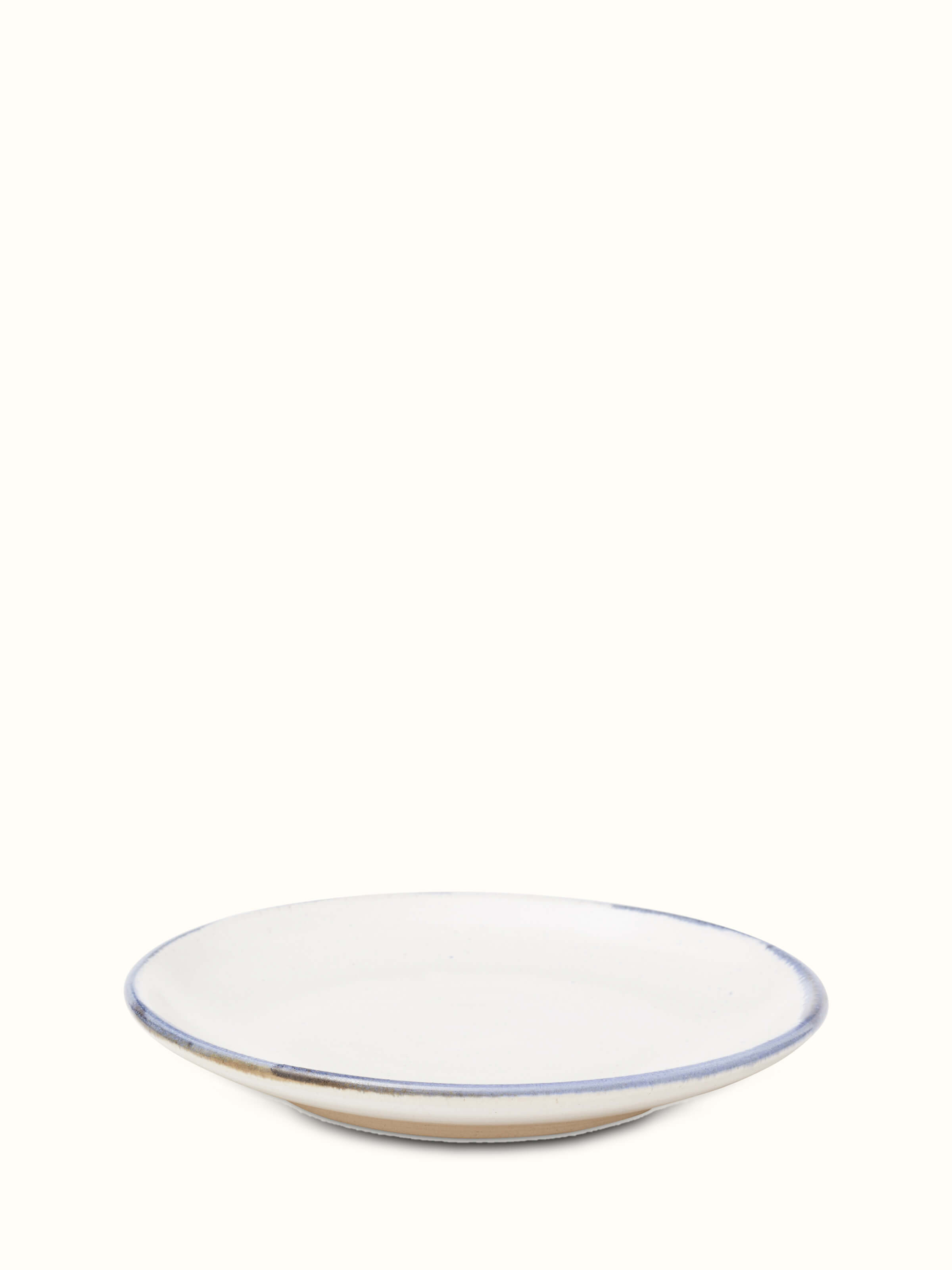 Side view of Studio pottery ceramic salad plate white