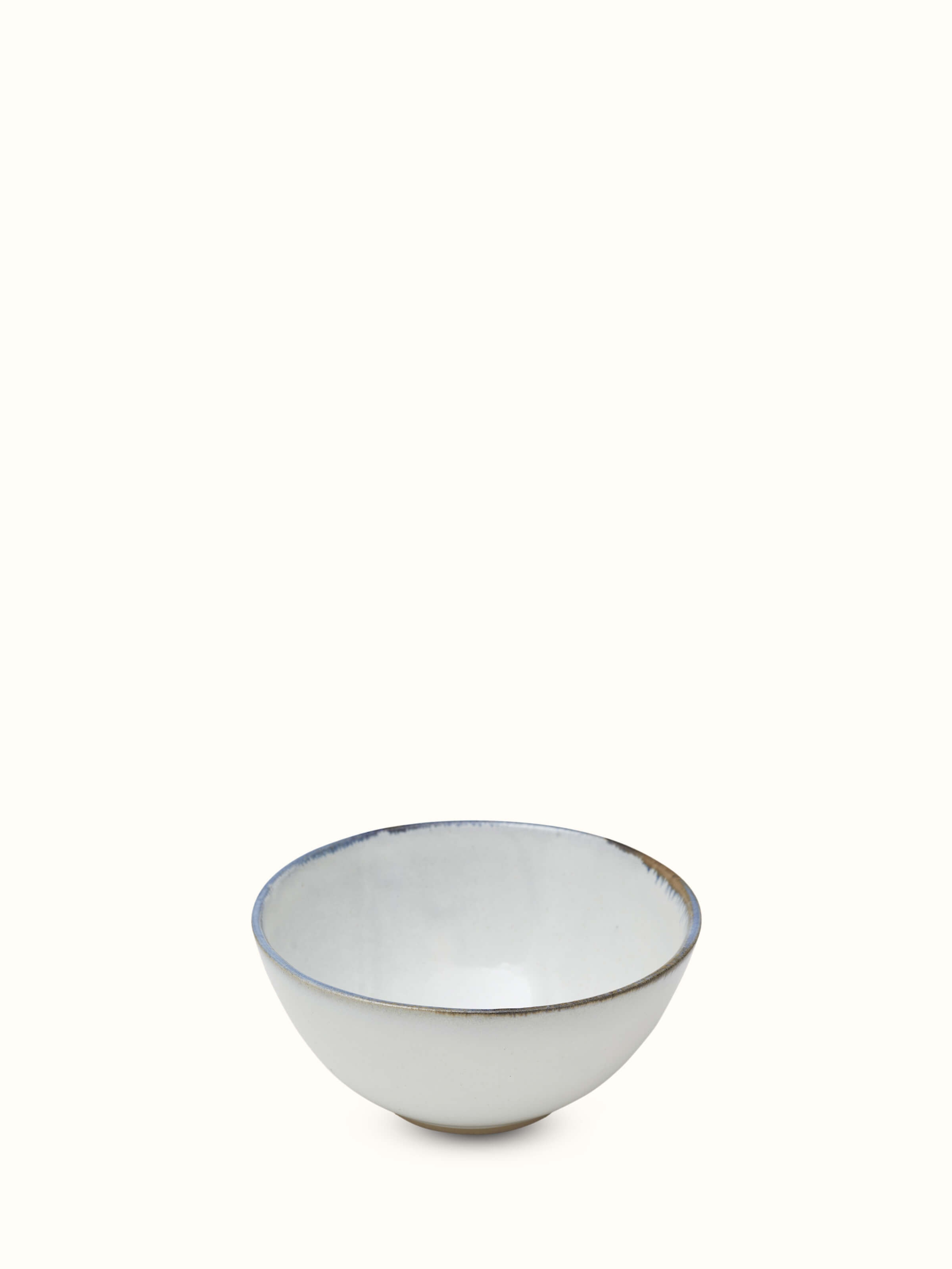 Angled view of glazed studio pottery ceramic serving bowl showing its unique glaze