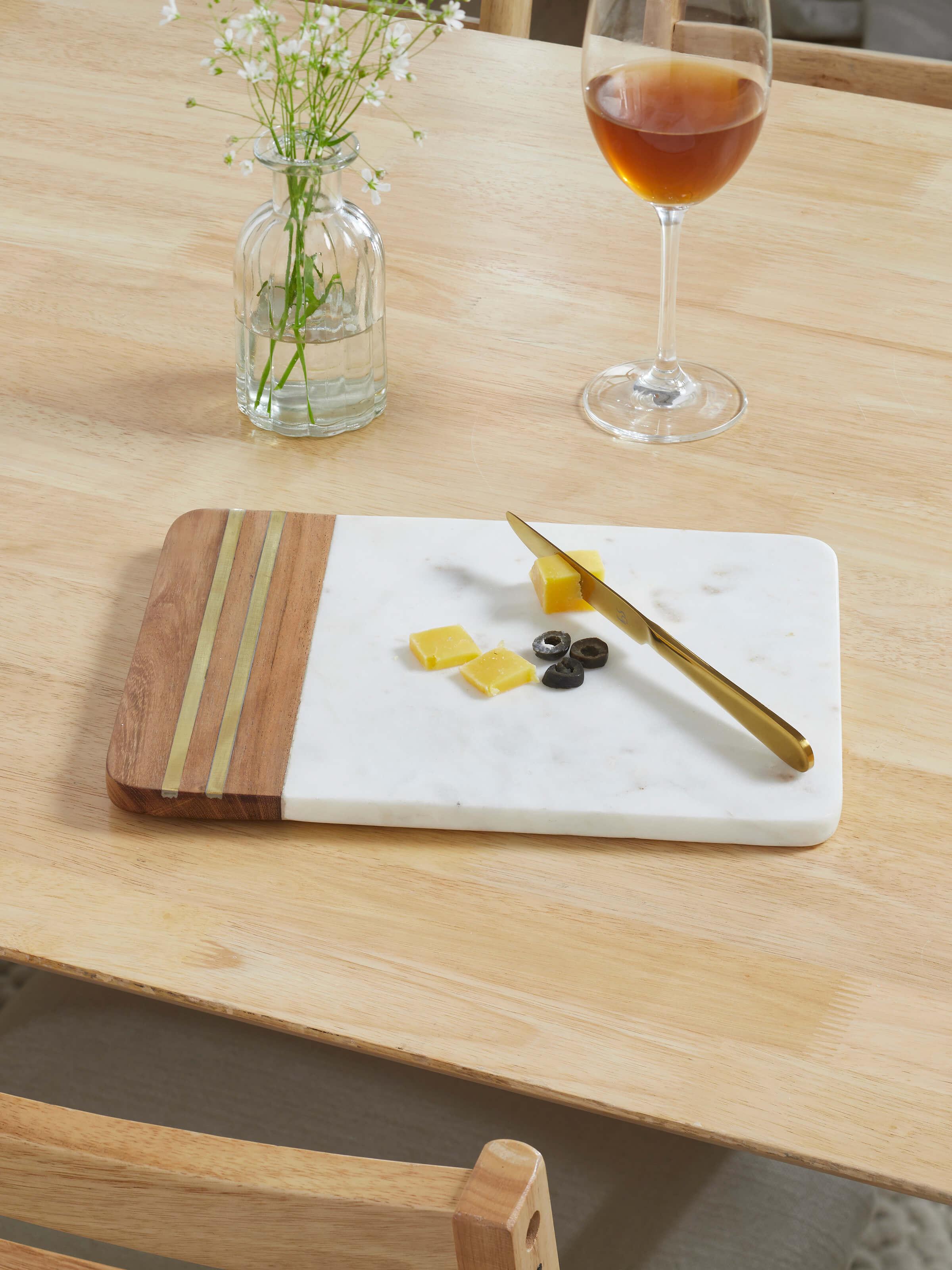 Top view of marble inlaid cheese board displaying elegant marble work.