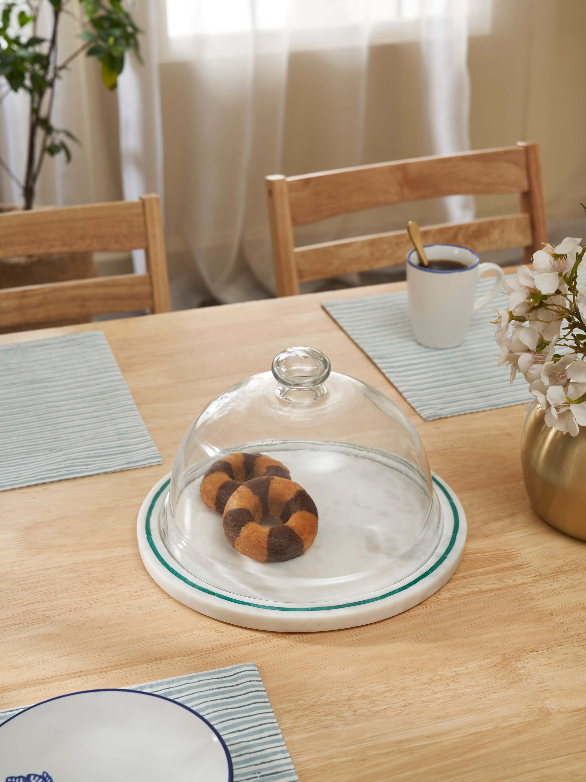 Side view of Marble Inlaid Cloche highlighting the elegant shape and craftsmanship.
