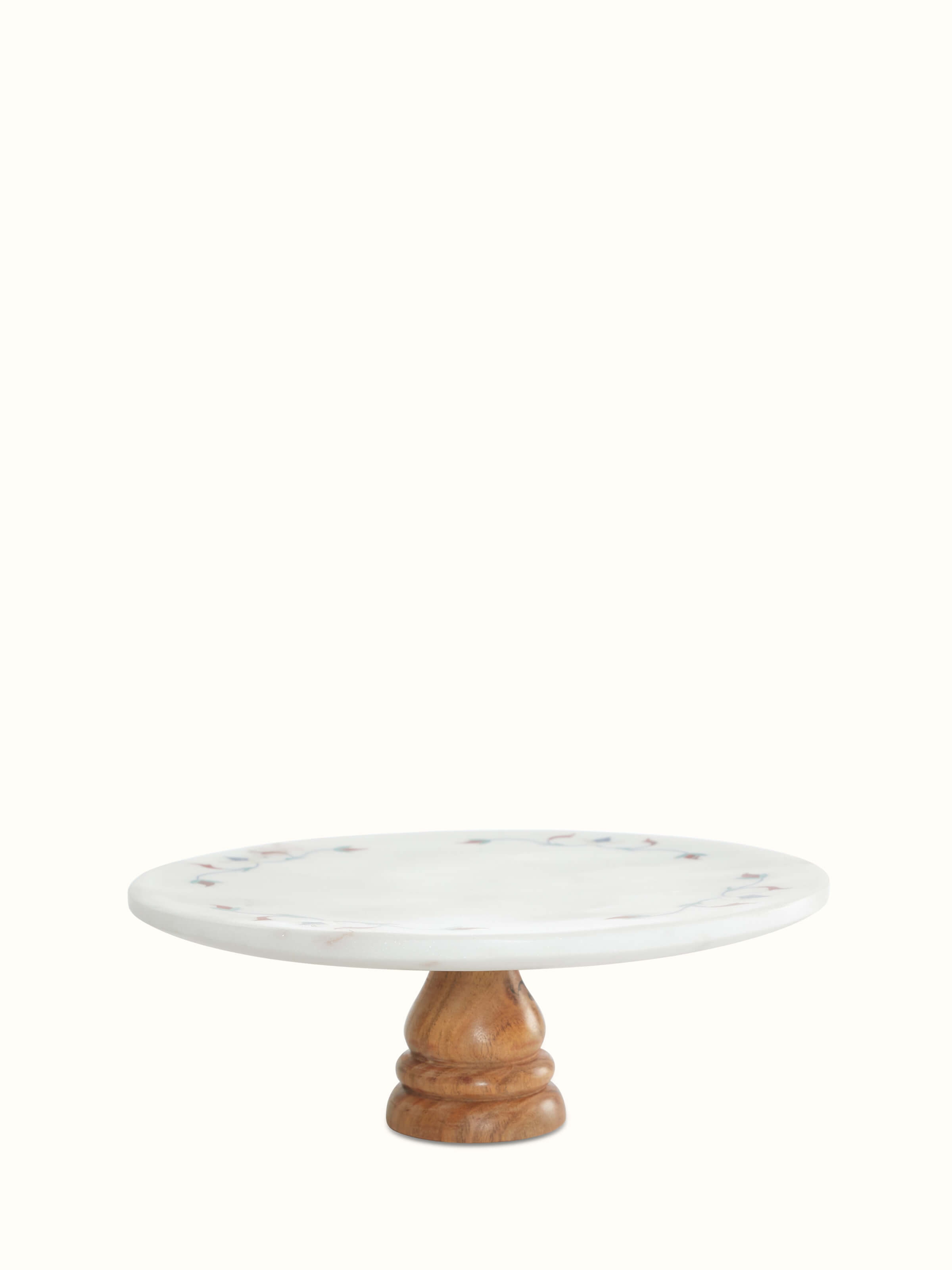Circular marble inlaid cake stand with intricate floral design, showcasing a refined and elegant presentation.
