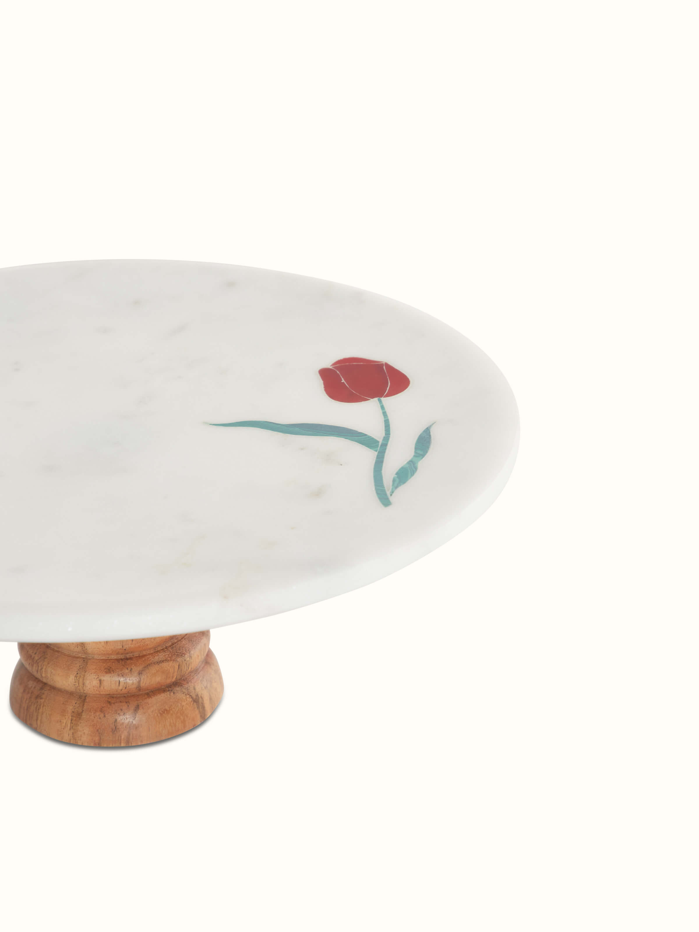 Top view of marble inlaid cake stand showcasing the round surface with ornate inlay patterns.