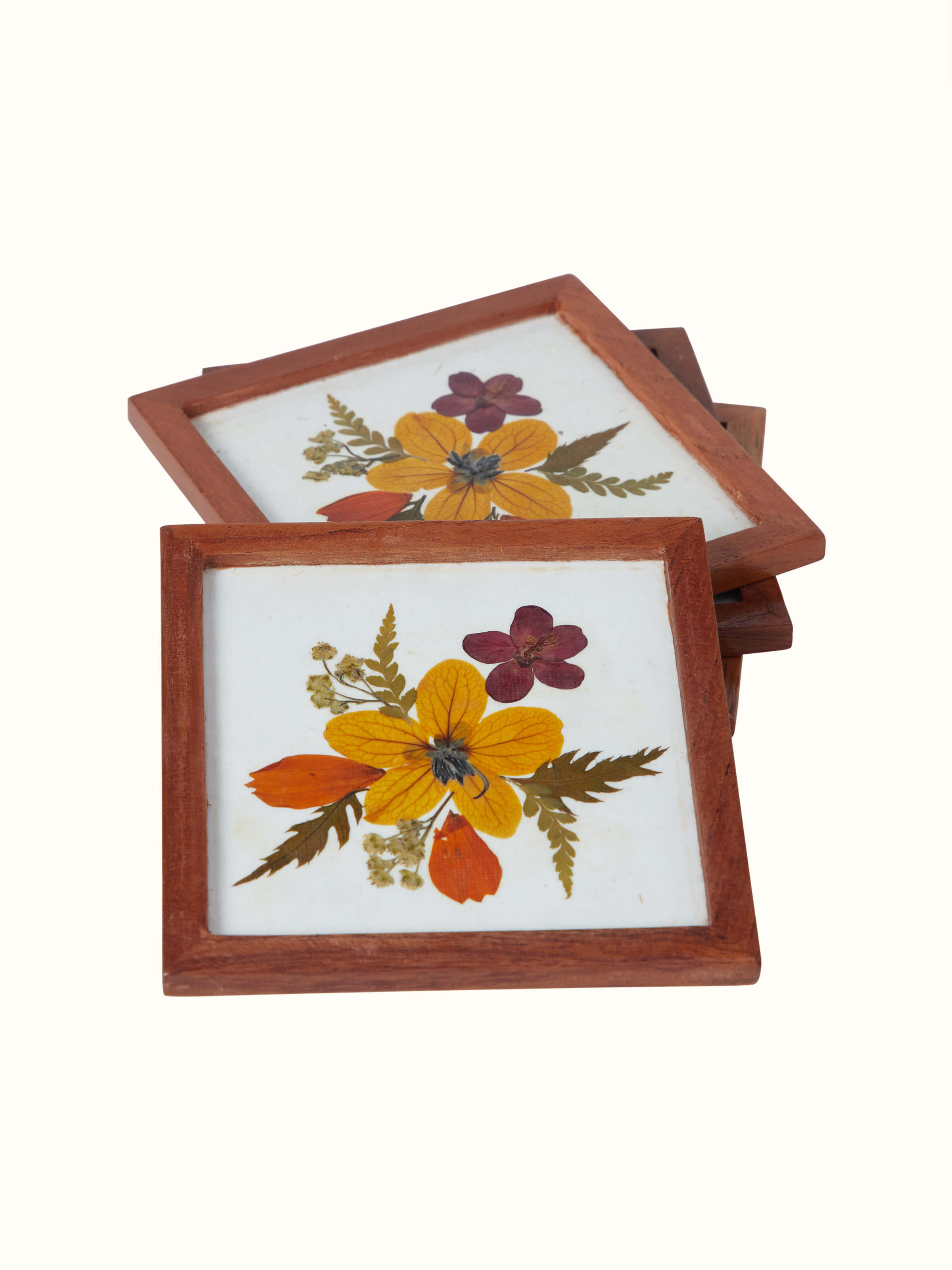Artistic view of Handmade paper floral coasters (4 pcs) focusing on the unique floral patterns and color details