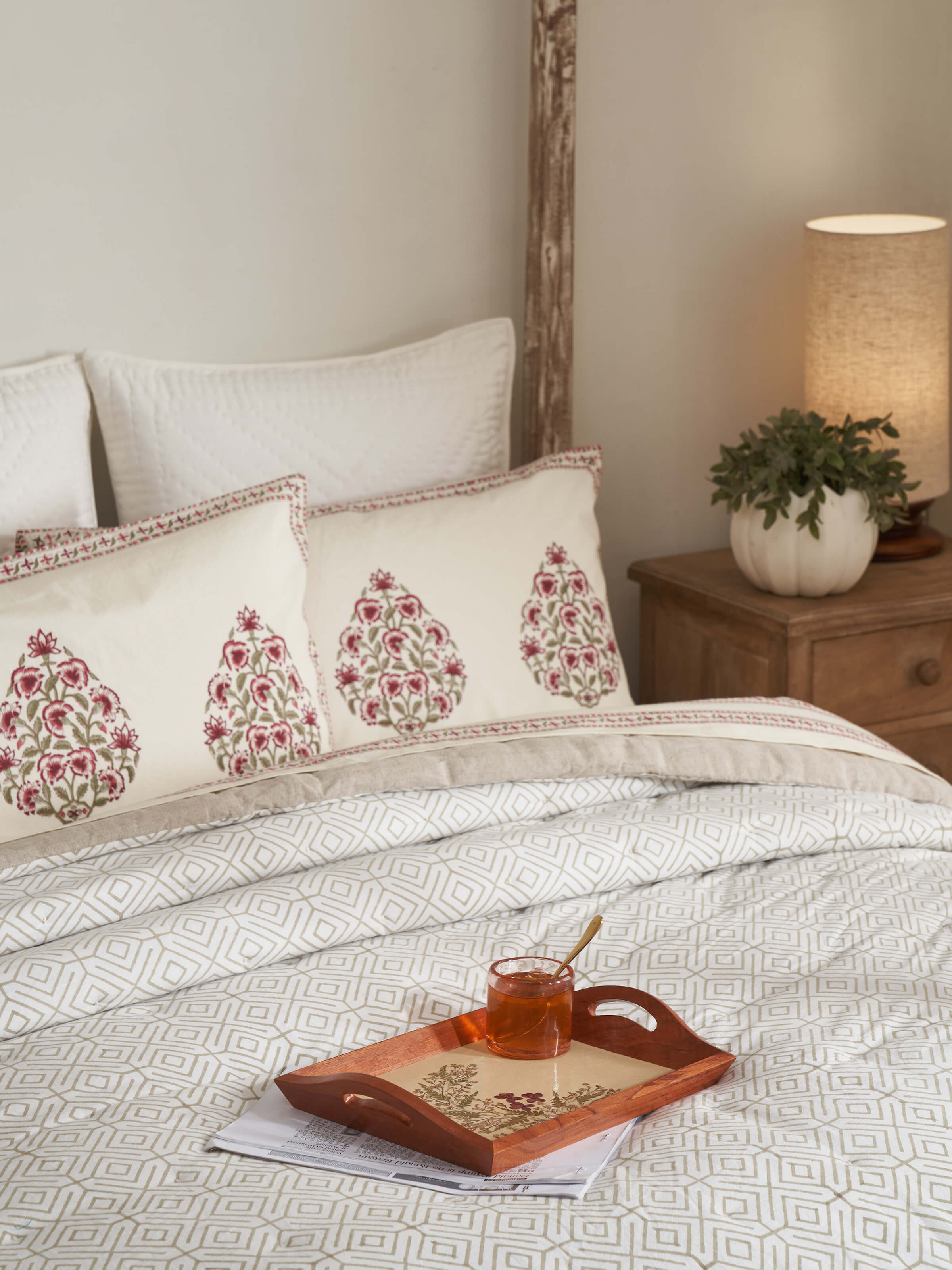 Detailed view of Auroville handmade paper floral tray highlighting traditional elements.