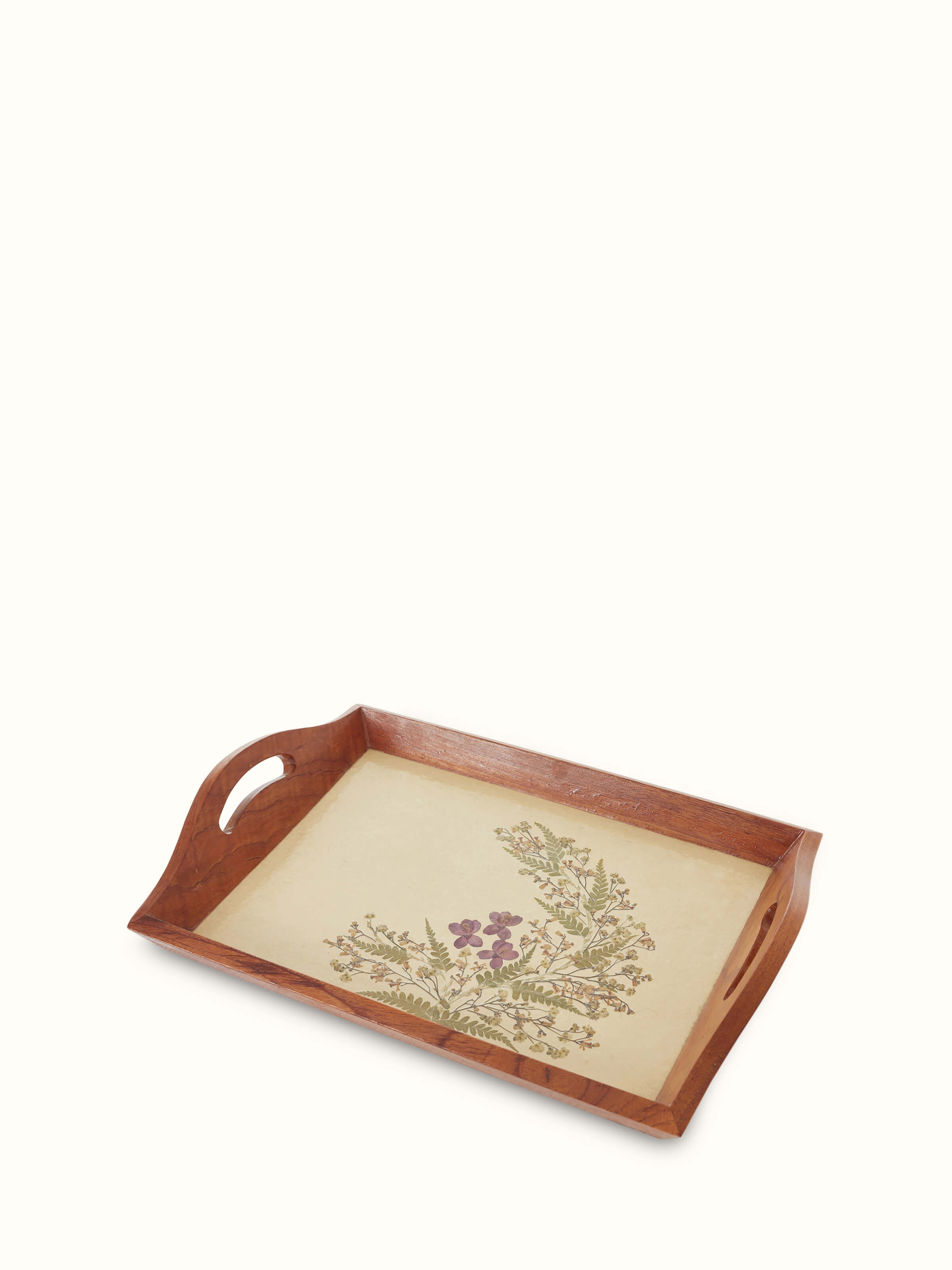 Close-up of Auroville handmade paper floral tray with intricate design.