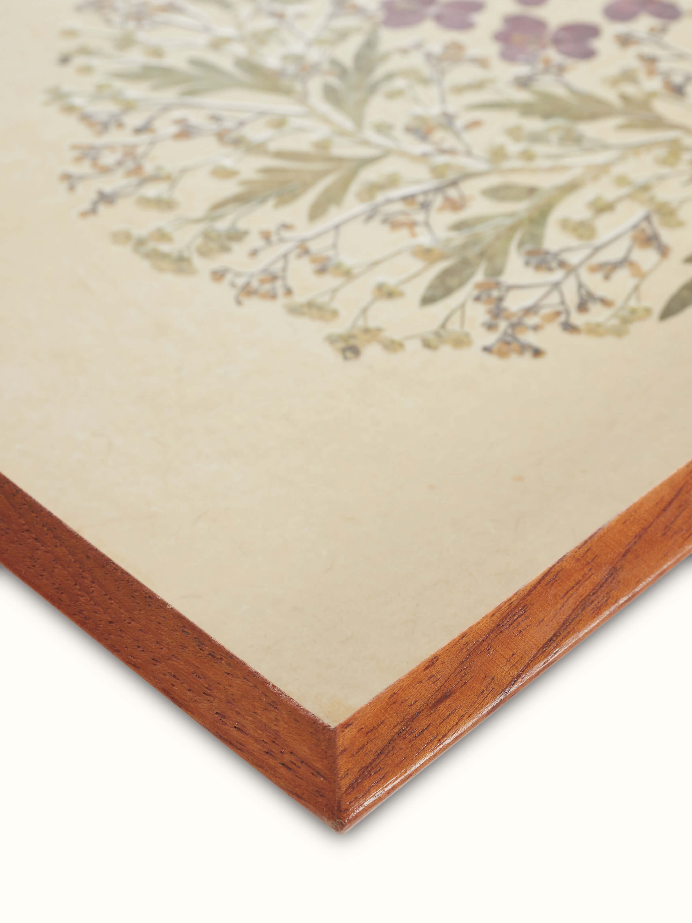 Close-up view of Auroville handmade paper floral tray with rich details.