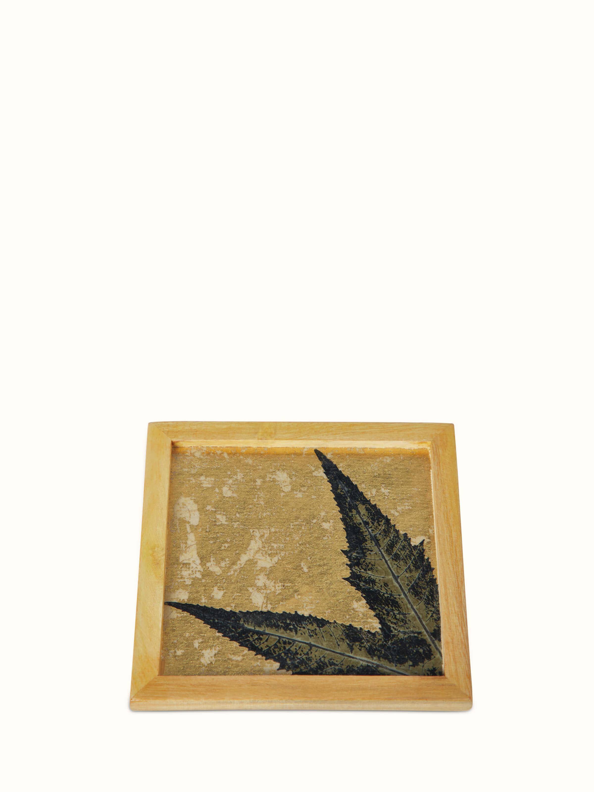 Side view of Auroville Handmade Paper Chinar Coasters, showing the coasters' thickness and chinar leaf imprint (2 pcs)