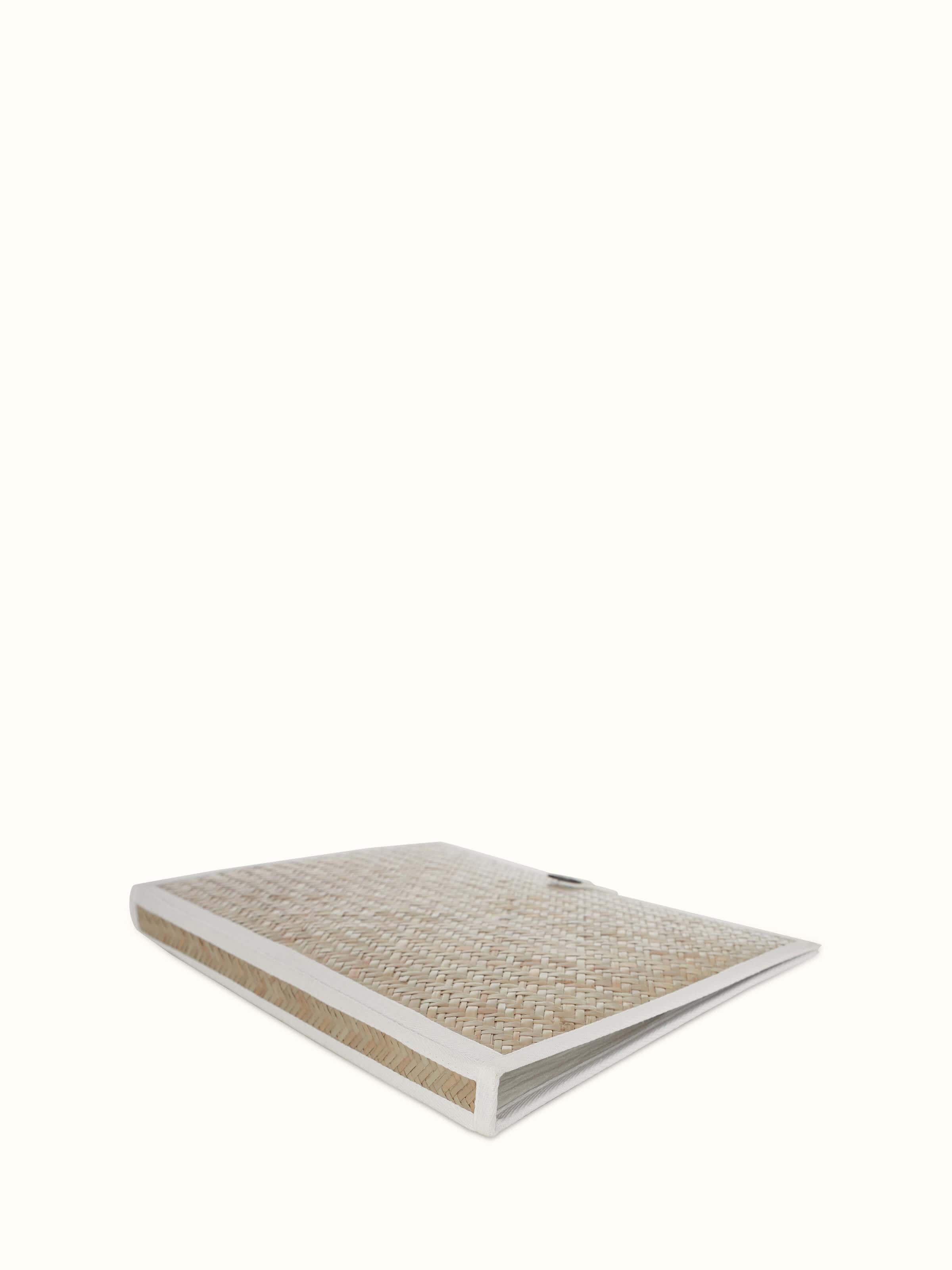 Angled view of bamboo sital patti file folder in brown focusing on the intricate weaving pattern.