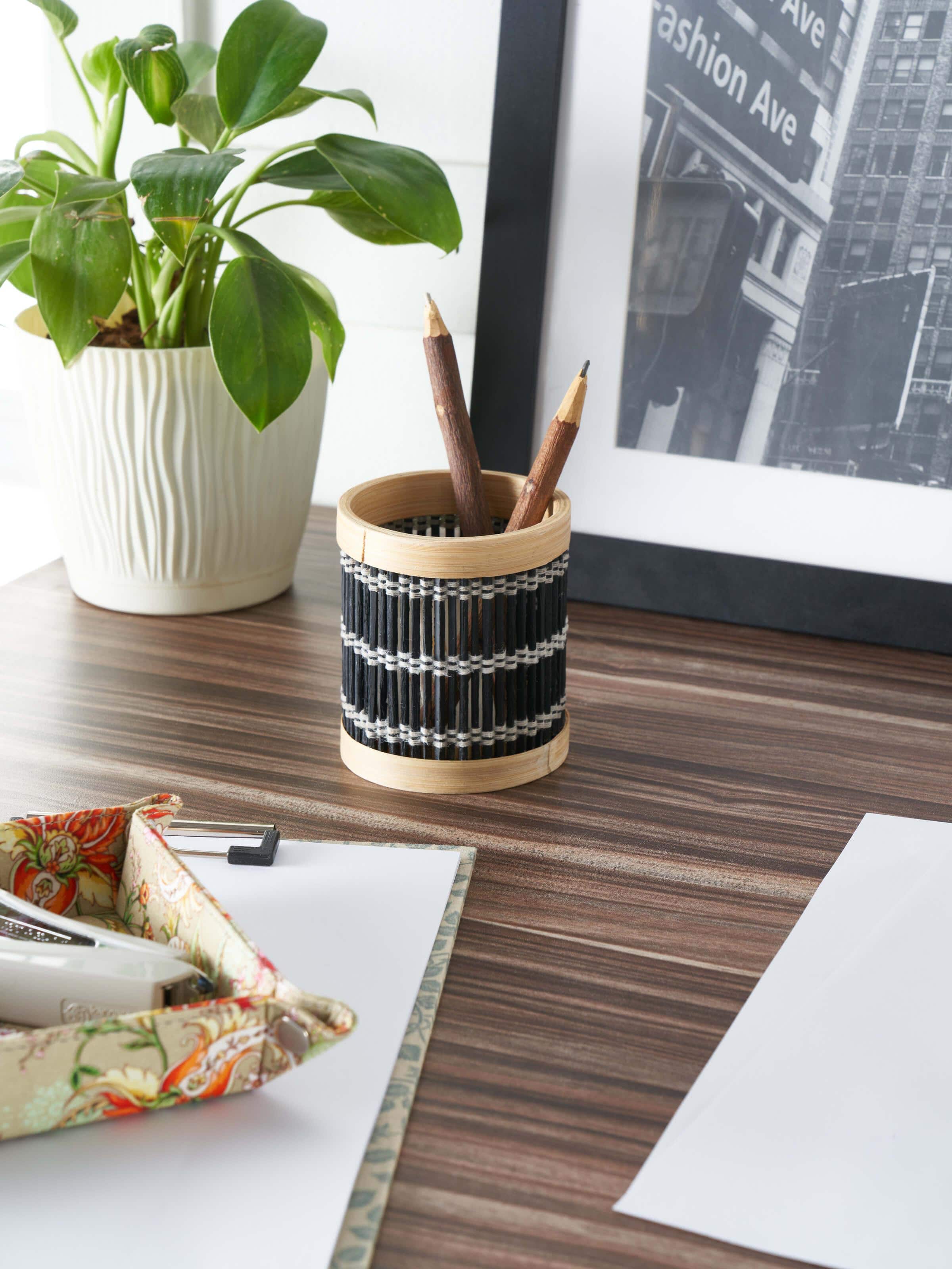 Side view of Bamboo Pen Stand in Black highlighting its minimalist design