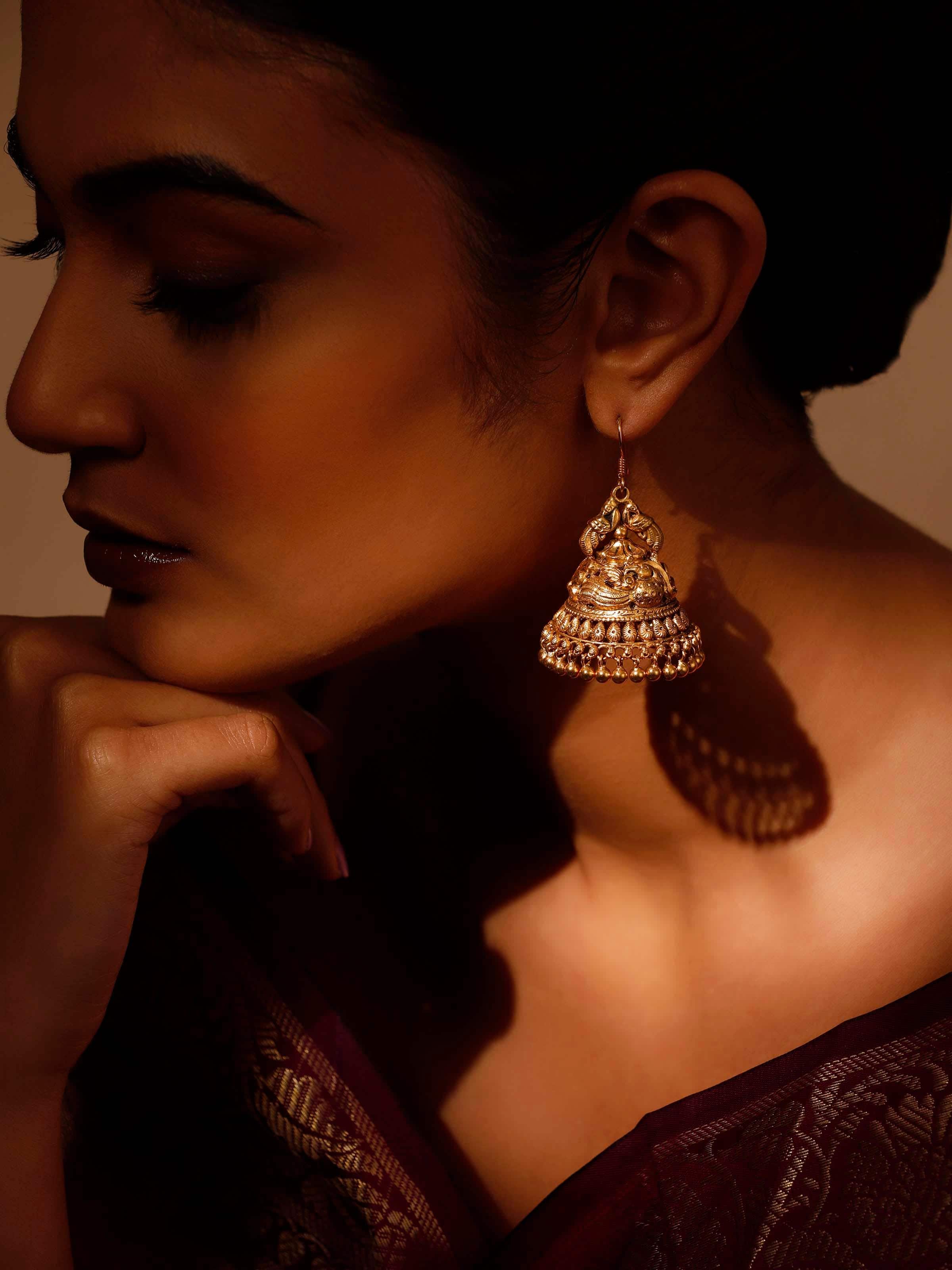 Side view of Silver Smithing Jhumkas highlighting their elegant hang and fine silver work.