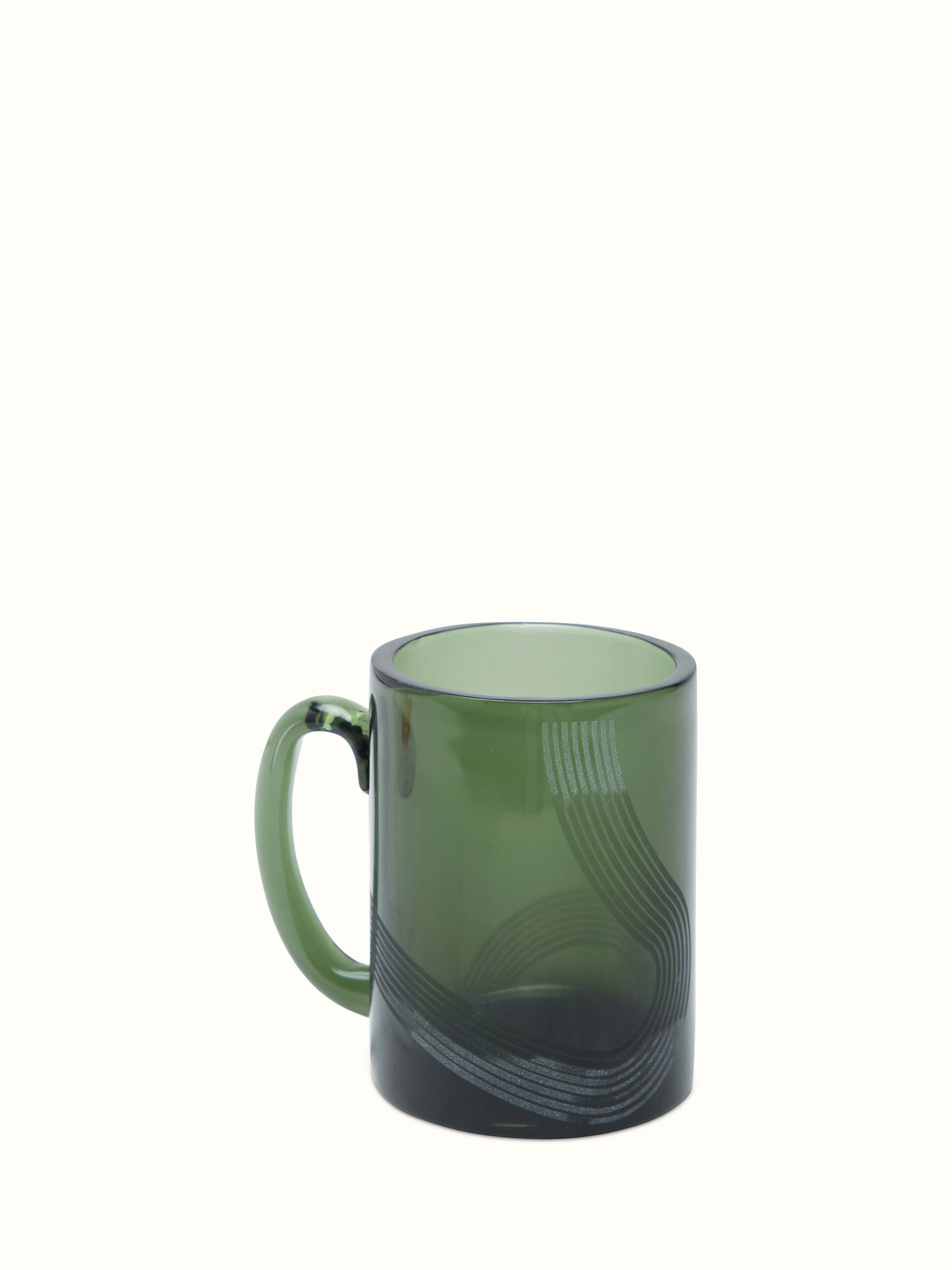 Close-up of Firozabadi green glass coffee mugs focusing on the fine texture and rich green color